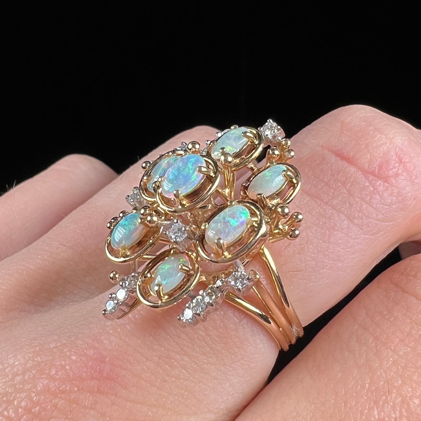 A ladies' vintage mid-century modern style opal and diamond cluster ring in yellow gold.