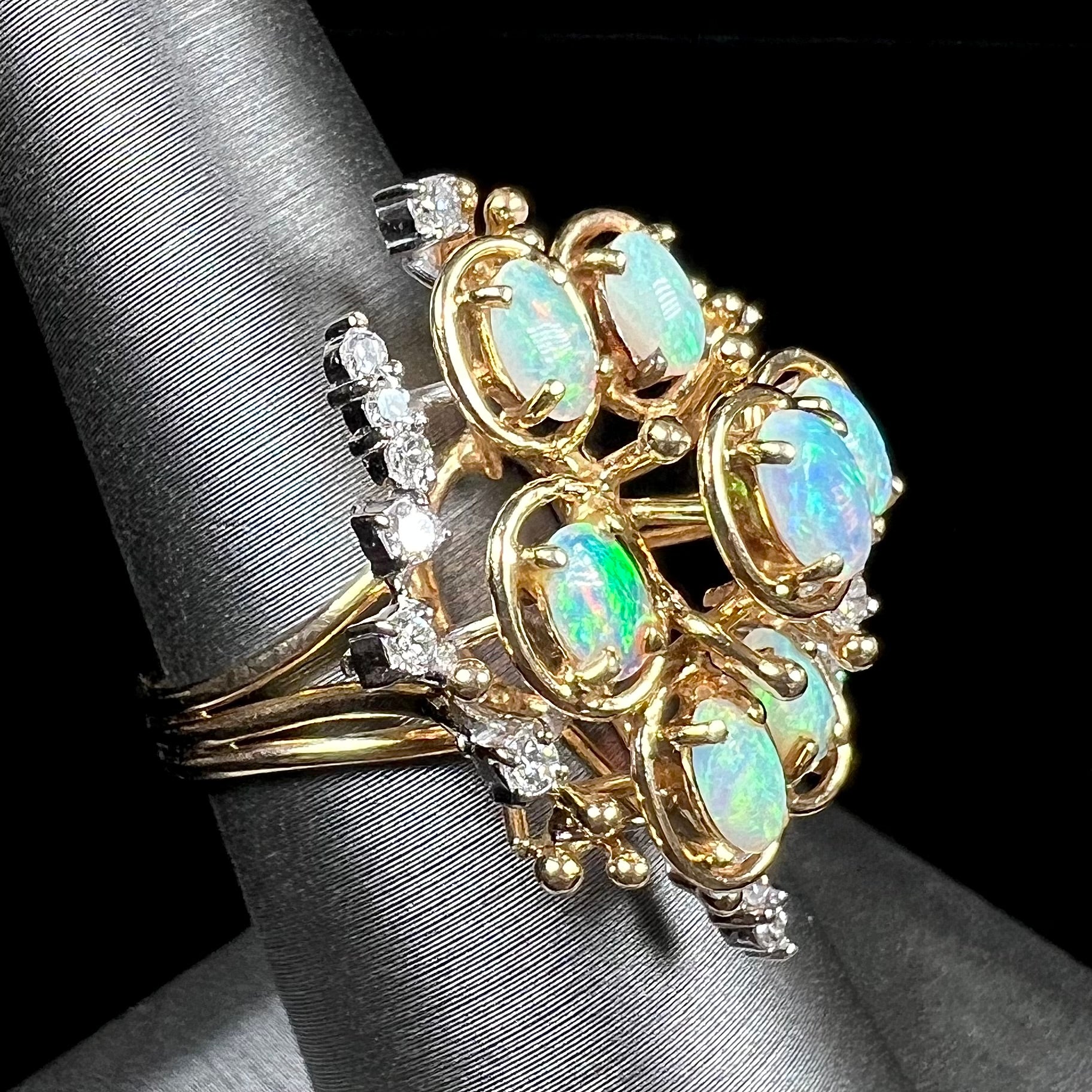 A ladies' vintage mid-century modern style opal and diamond cluster ring in yellow gold.