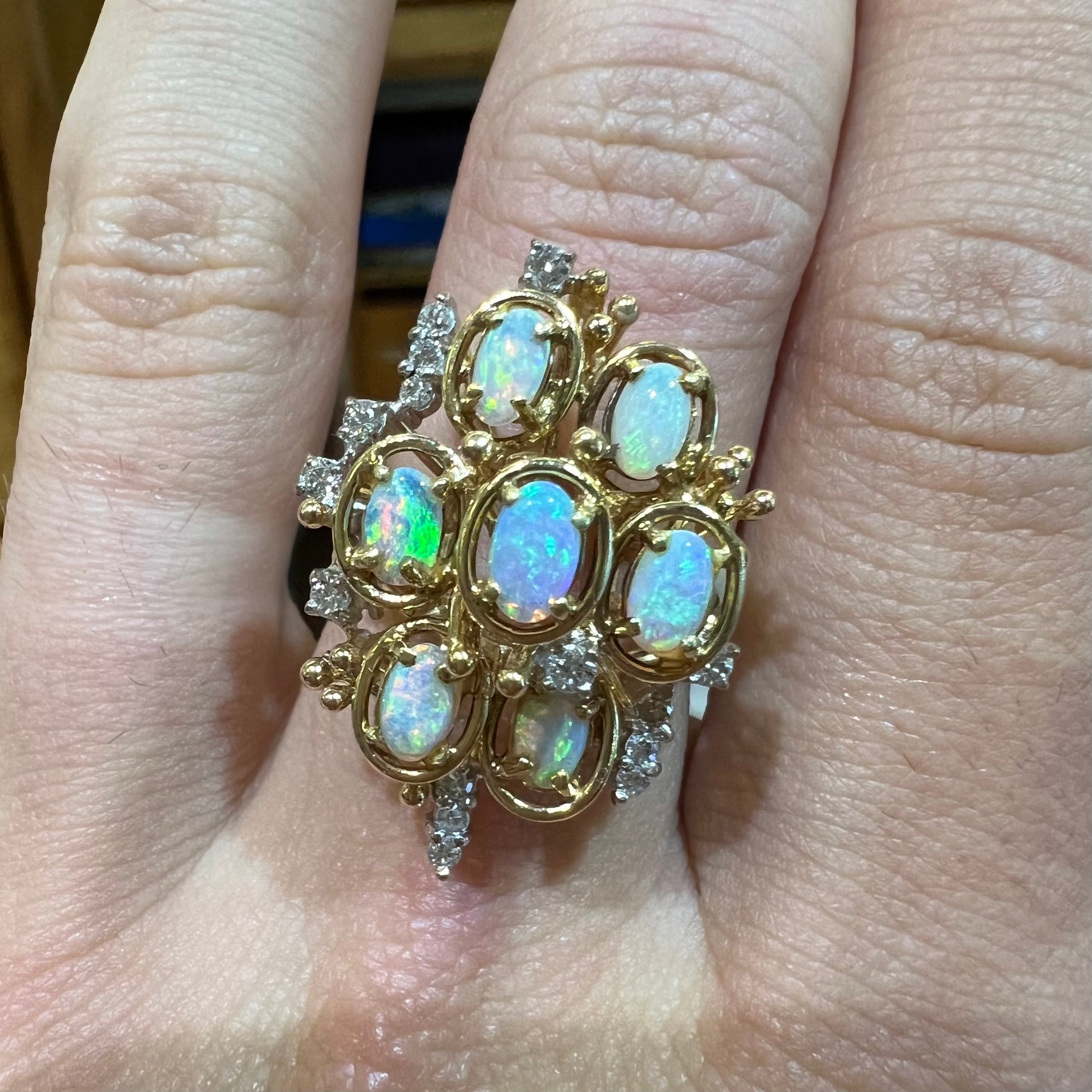 A ladies' vintage mid-century modern style opal and diamond cluster ring in yellow gold.