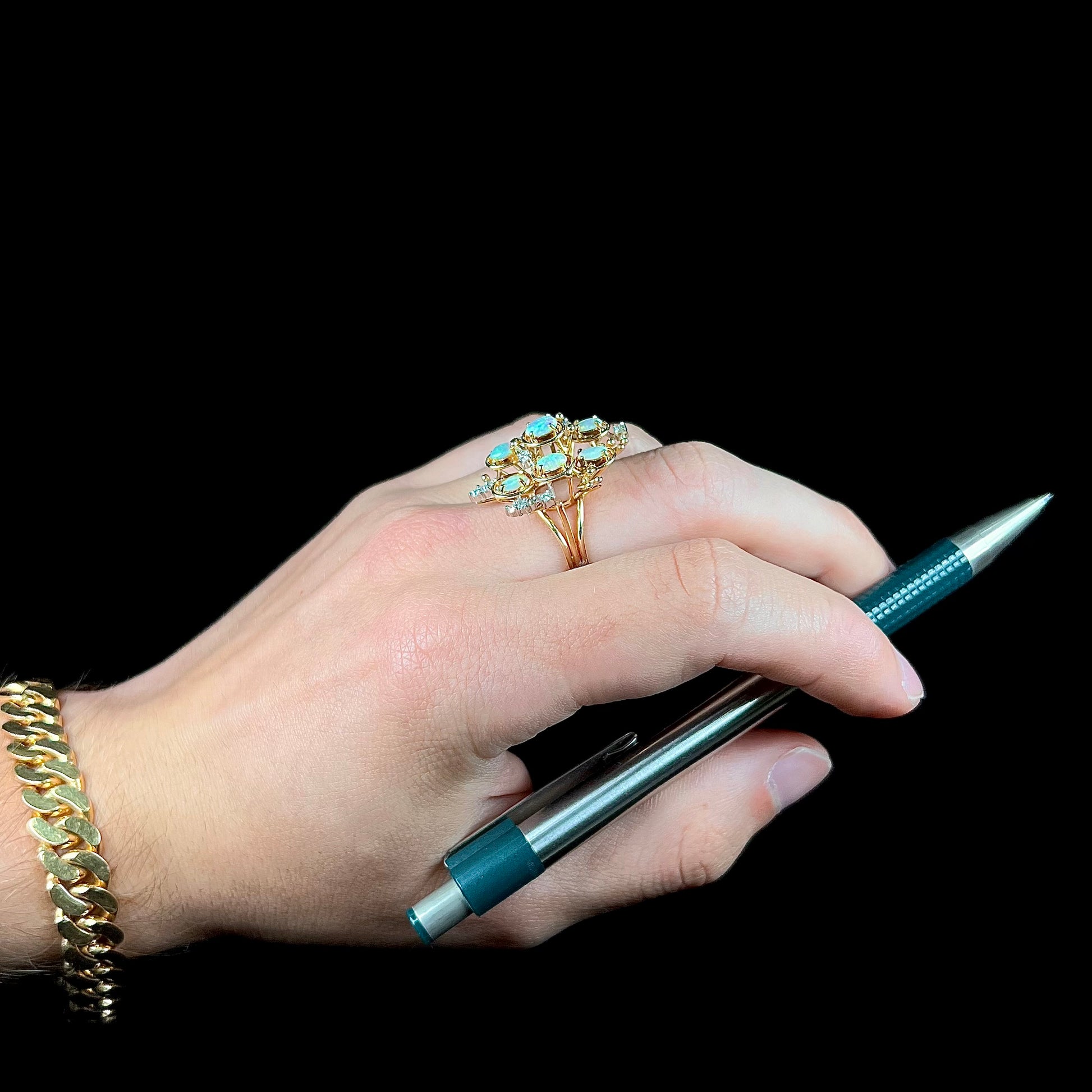 A ladies' vintage mid-century modern style opal and diamond cluster ring in yellow gold.