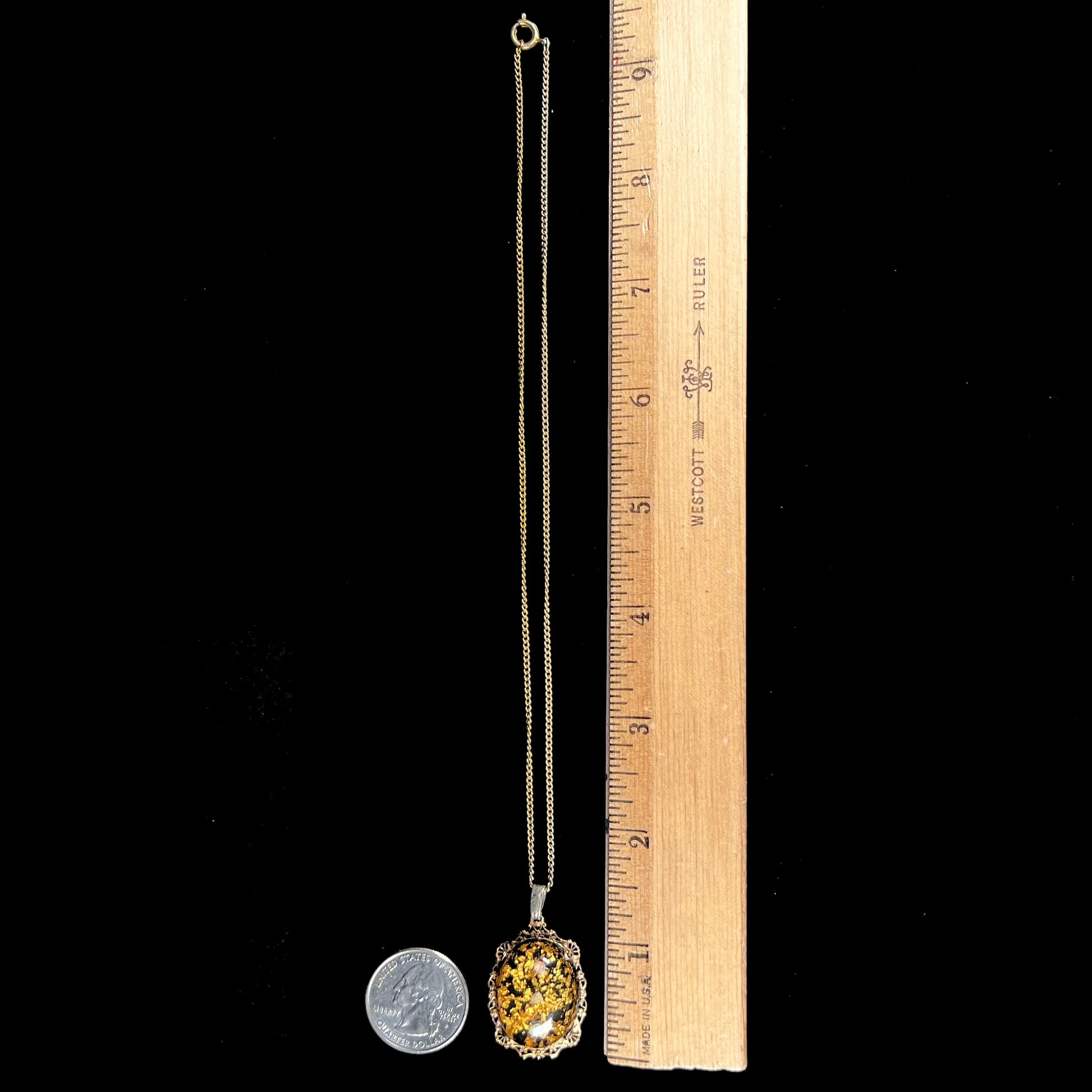 A vintage gold filled filigree necklace set with three rough opal crystals and gold leaf flakes.
