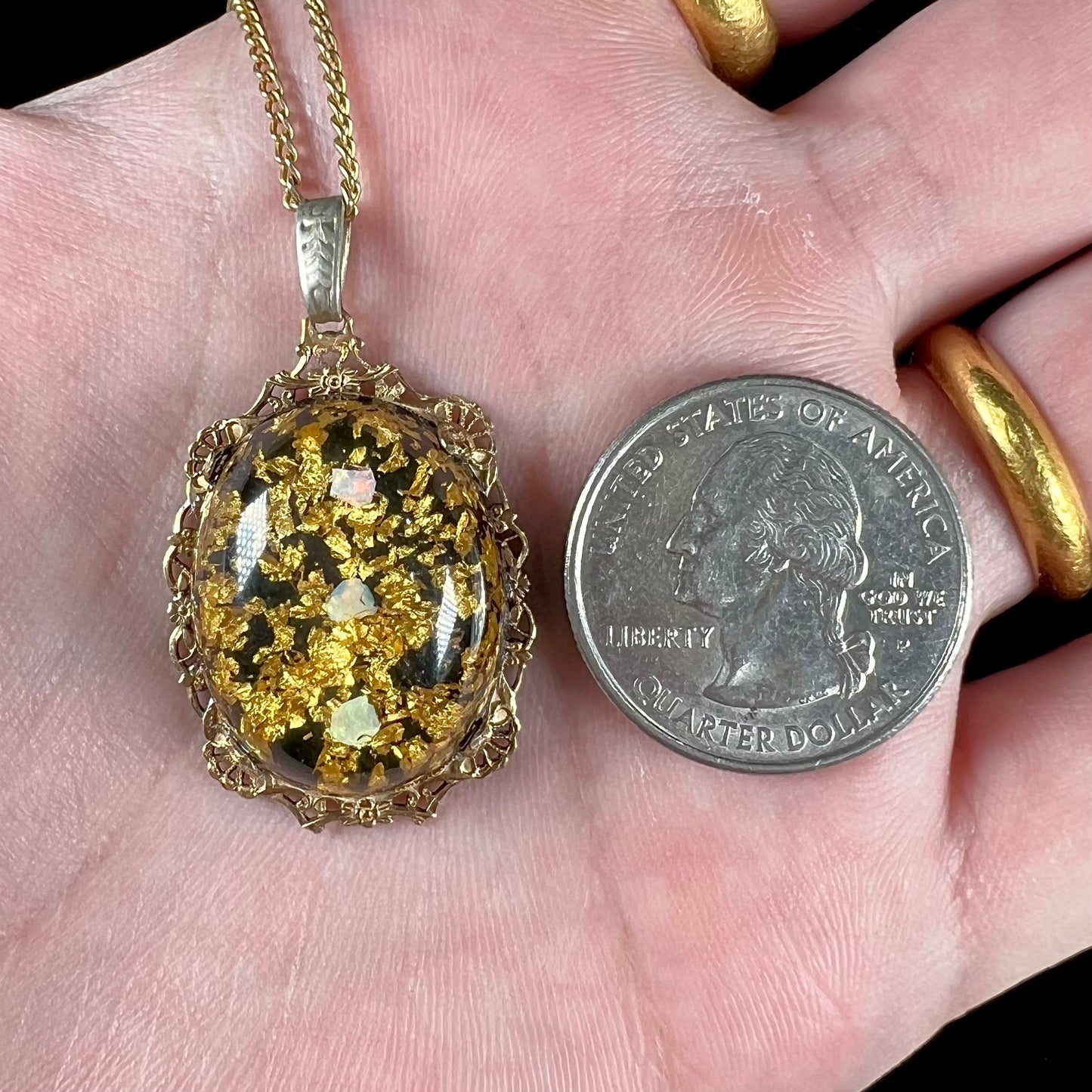 A vintage gold filled filigree necklace set with three rough opal crystals and gold leaf flakes.