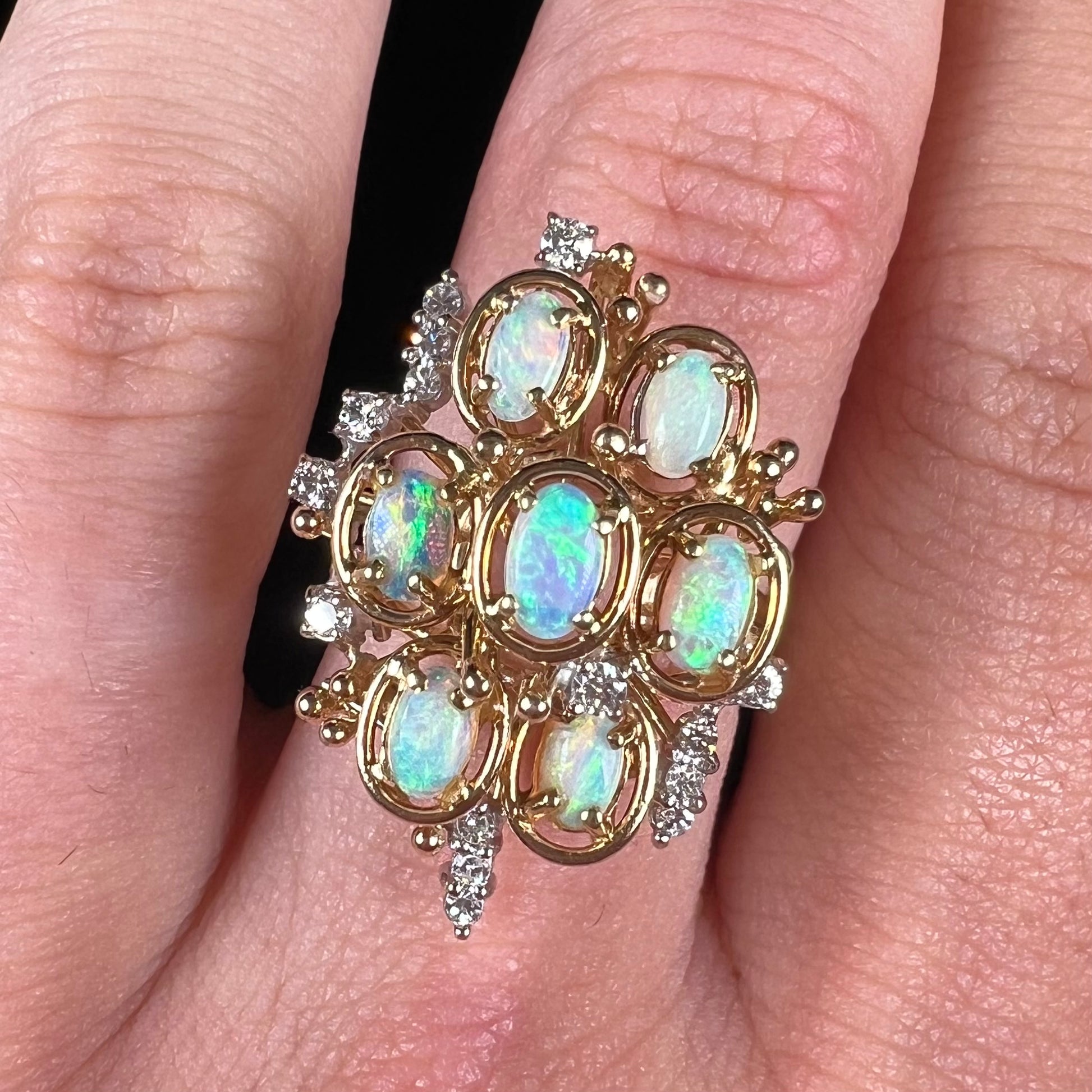 A ladies' vintage mid-century modern style opal and diamond cluster ring in yellow gold.