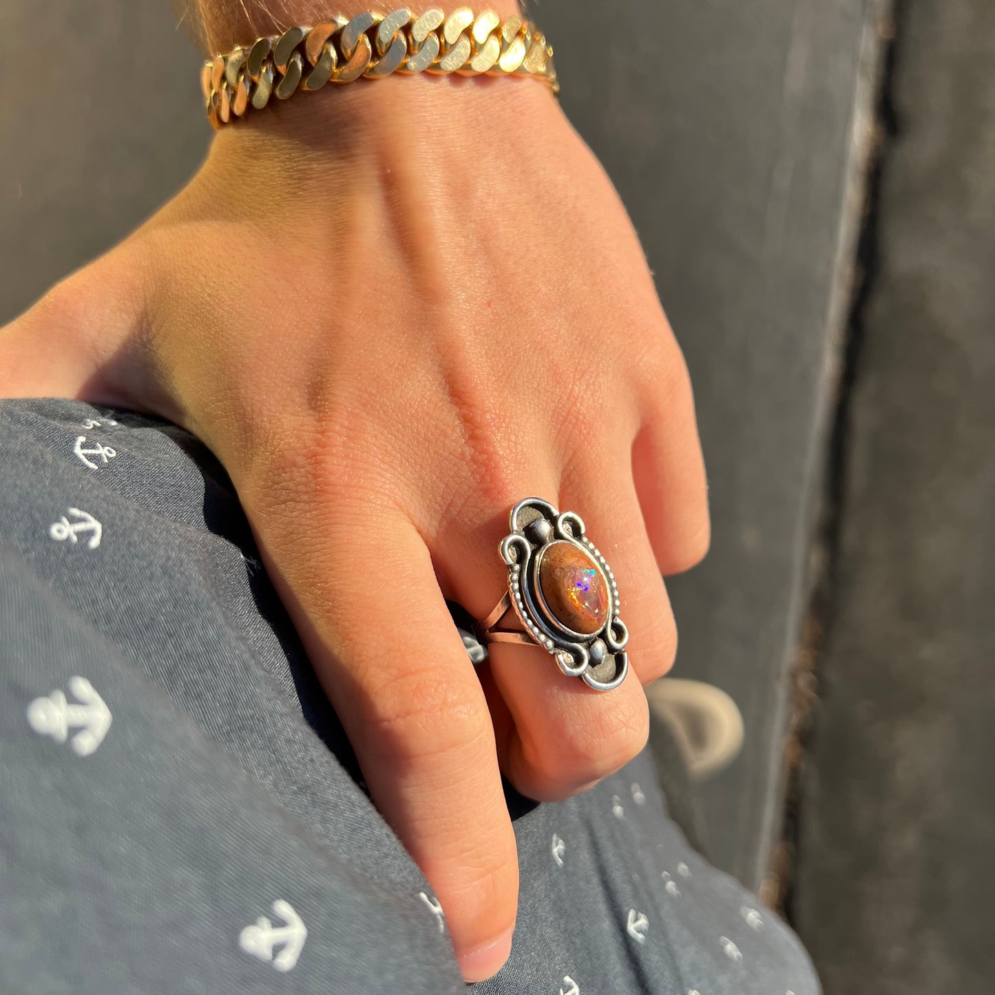 A vintage, Navajo style sterling silver ring set with an oval cabochon cut cantera fire opal stone.