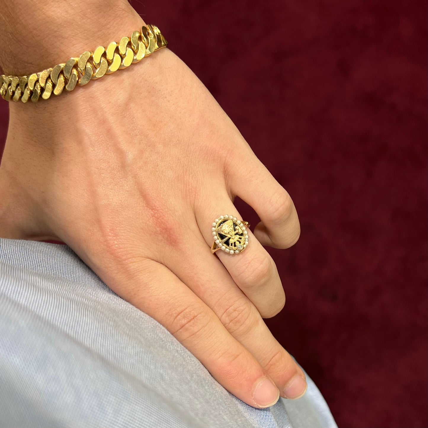 A ladies' Job's Daughters youth organization ring cast in 14 karat gold, set with a diamond and string of pearls.