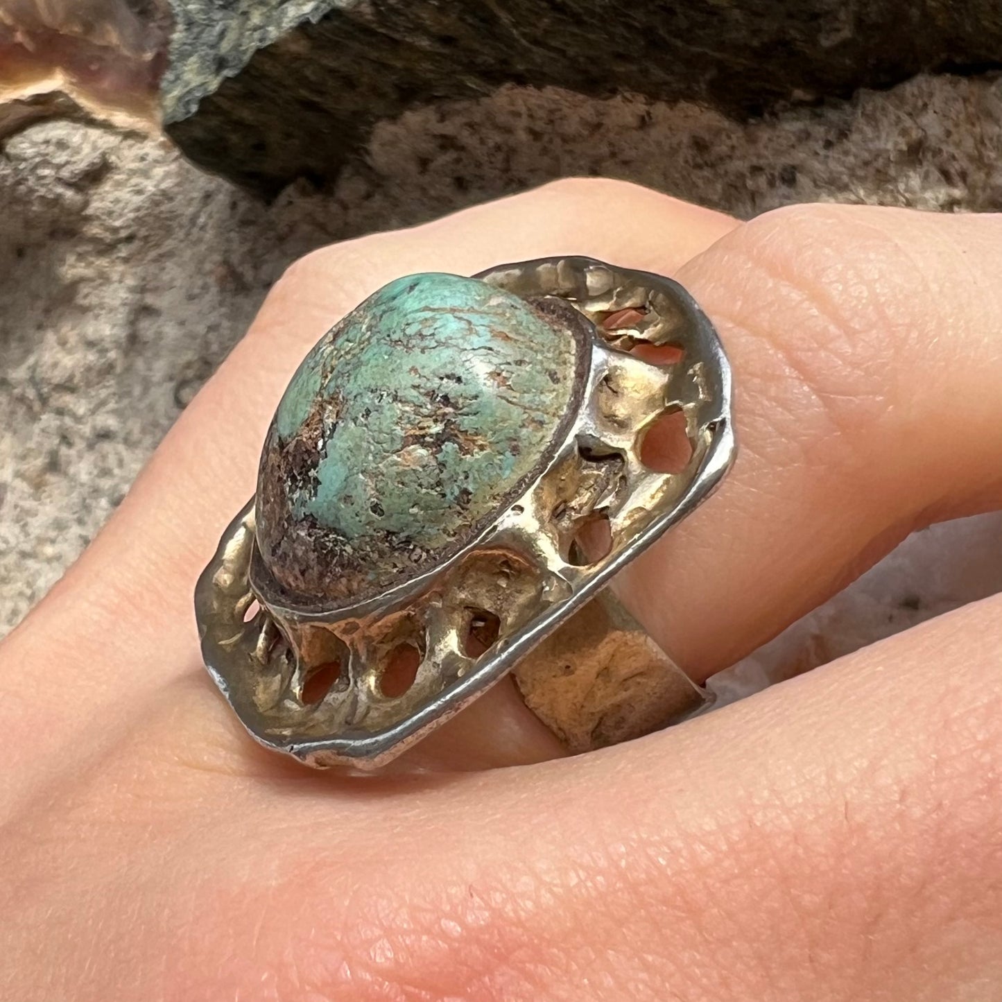 A unisex sterling silver ring with a gold wash, set with a natural, unstabilized Valley Blue turquoise stone.