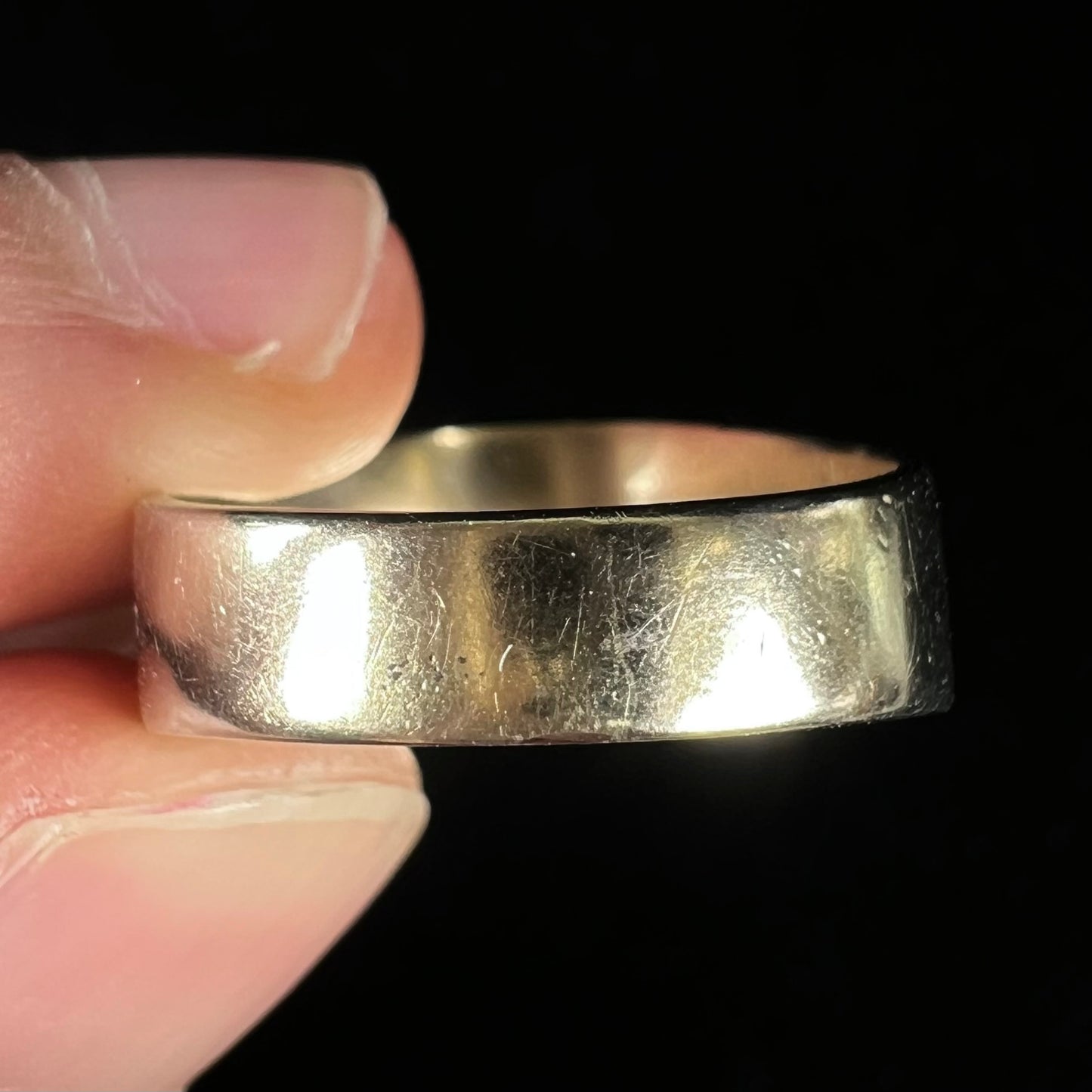 A vintage, 1940's style white gold diamond wedding ring set with a 0.68ct round diamond. The diamond has a noticeable black crystal inclusion.