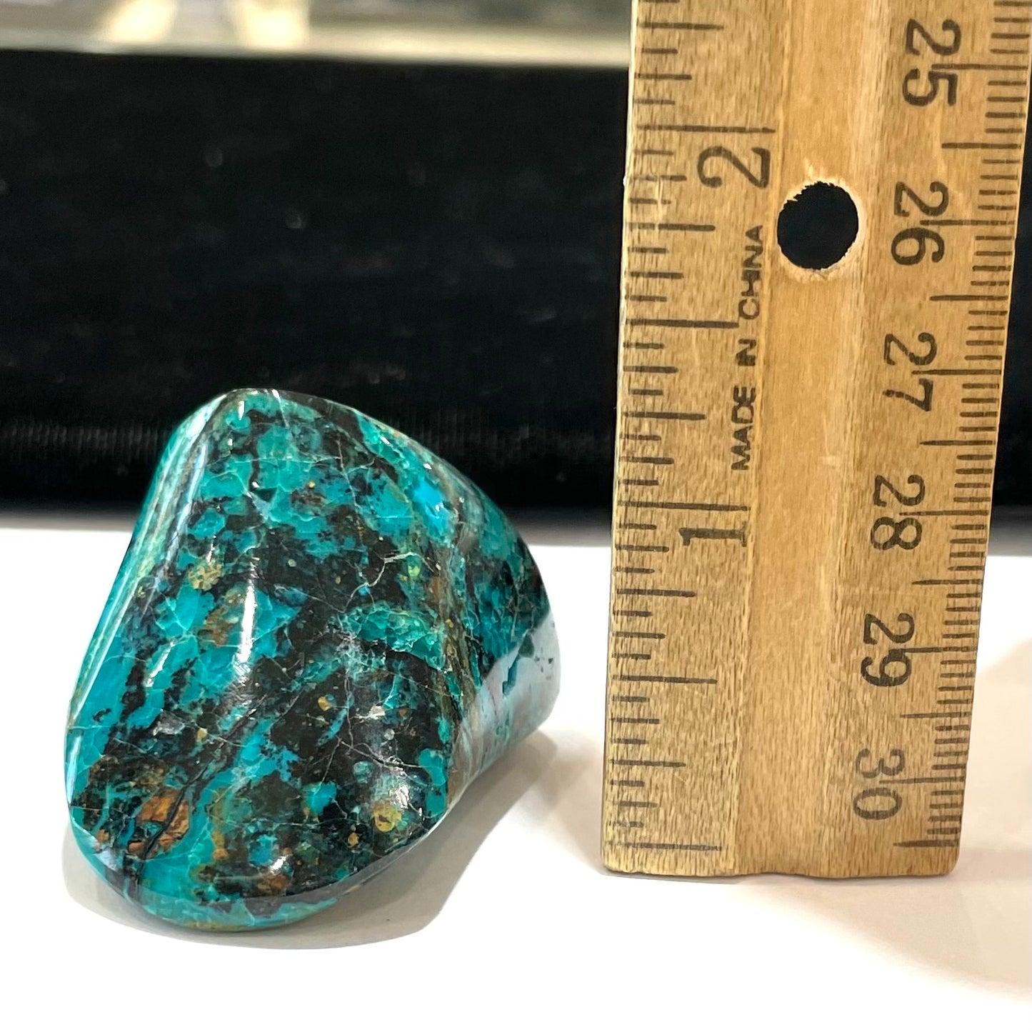 A polished freeform shaped chrysocolla specimen.