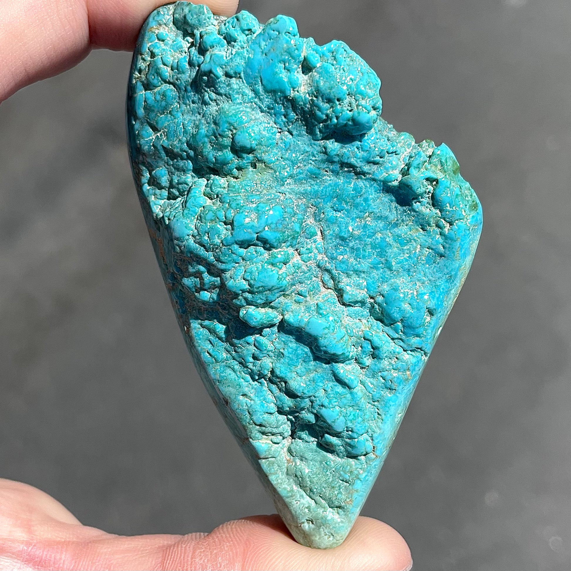A loose, lightly polished turquoise nugget from Sleeping Beauty Mine, Arizona.