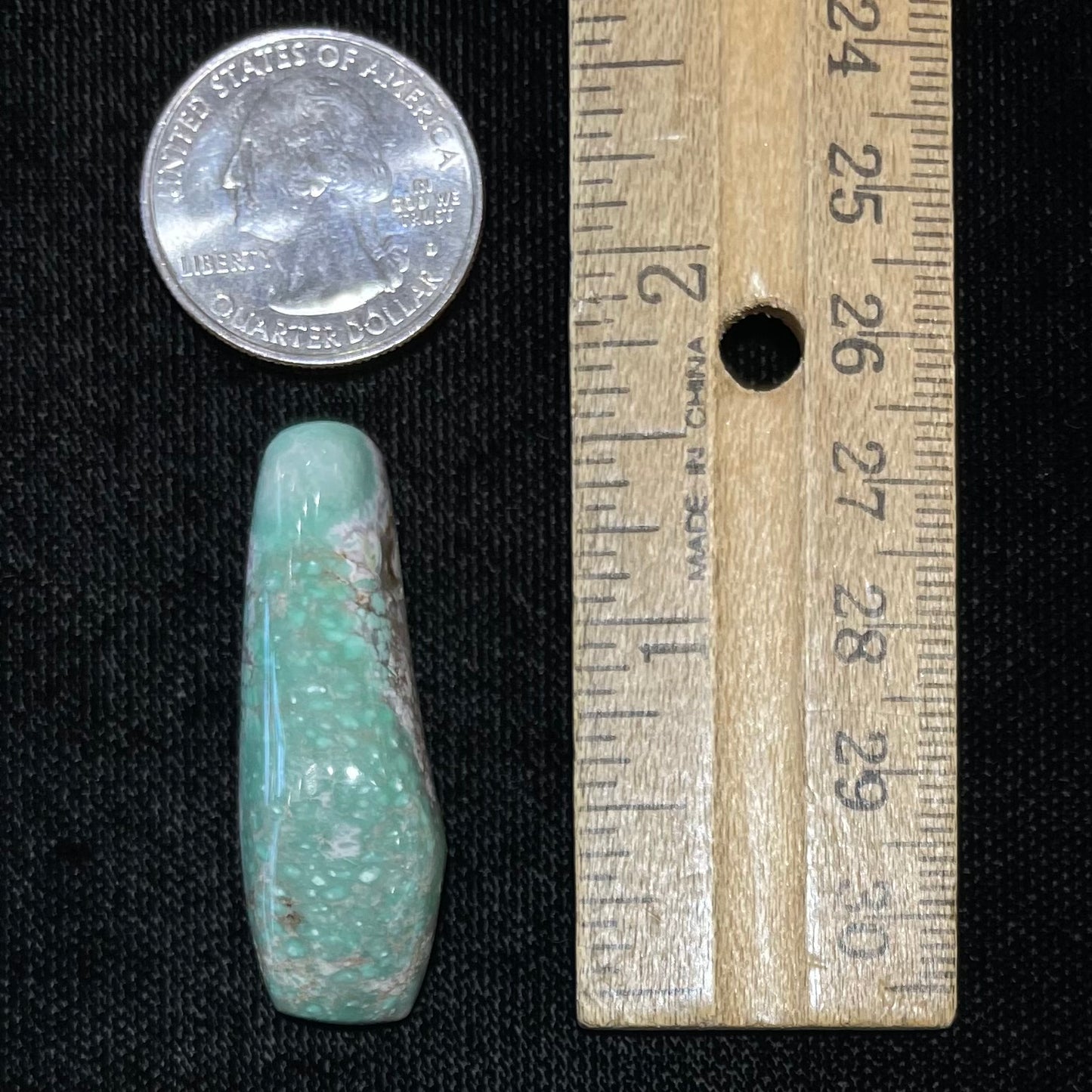 A loose, polished variscite stone from Utah, USA.