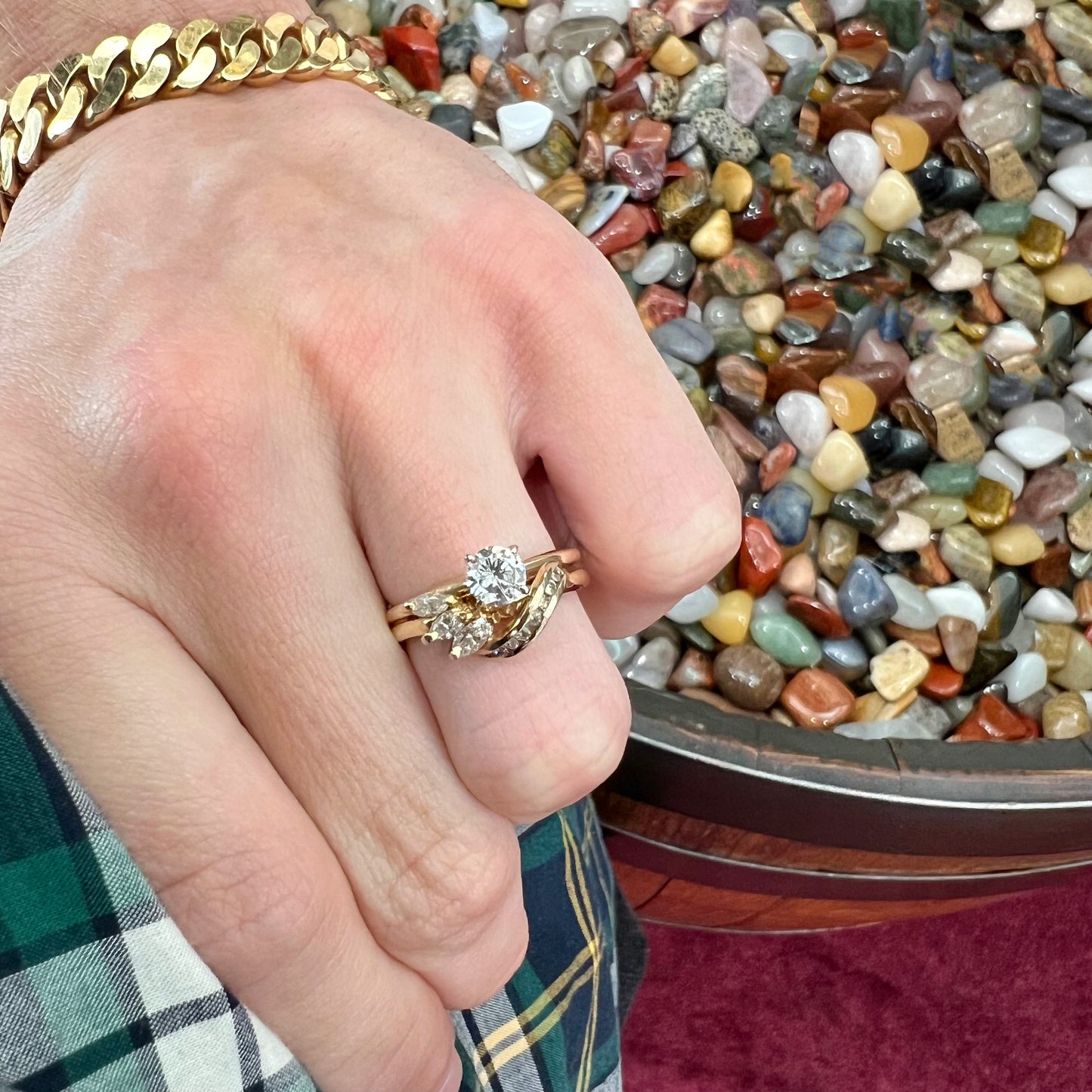A ladies' diamond wedding set that has been soldered together in yellow gold. There are round and marquise cut diamonds.