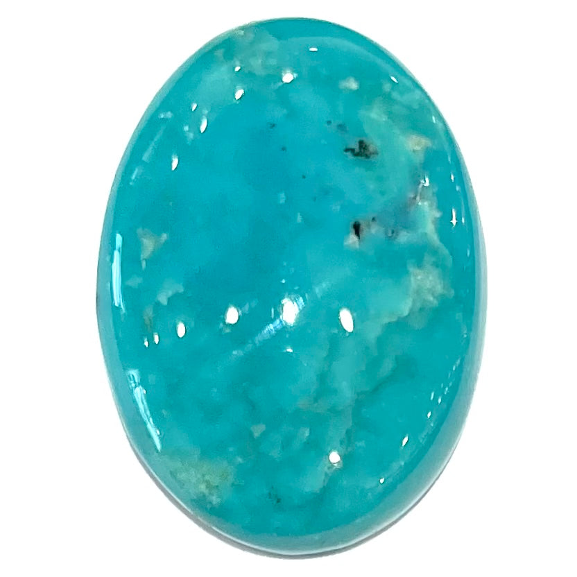 A loose, oval cabochon cut blue turquoise stone from Royston Mining District, Nevada.