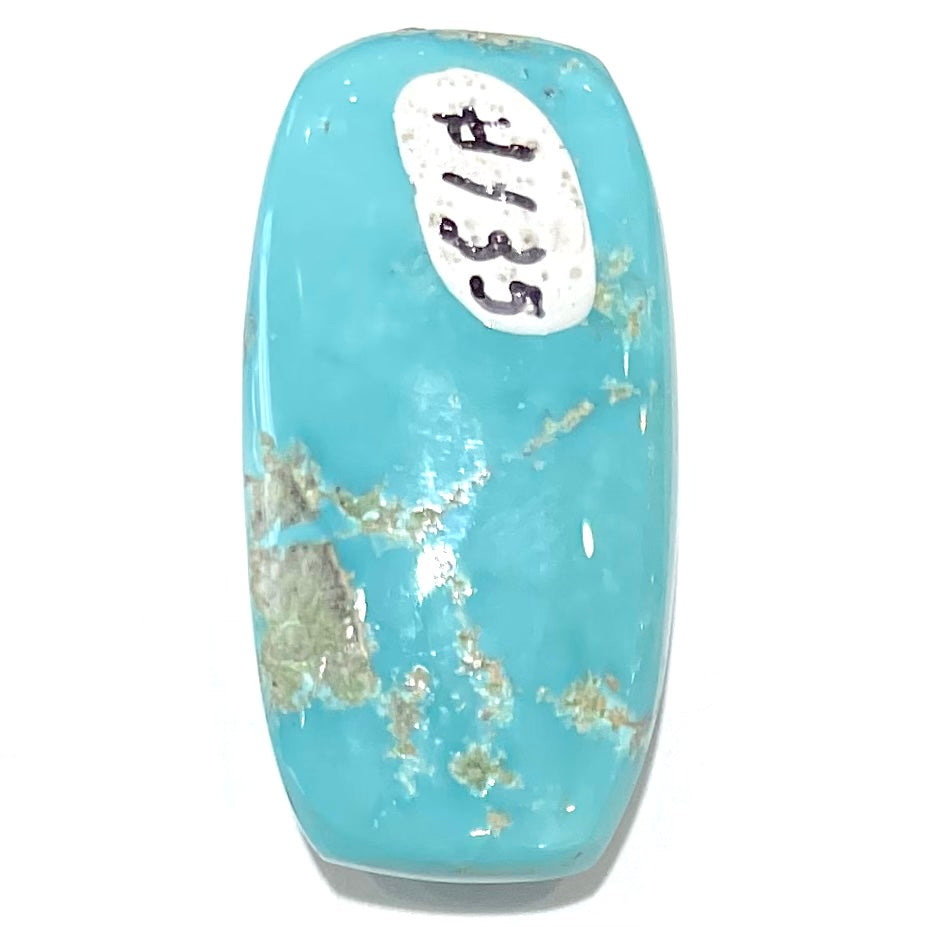 A loose, barrel cabochon cut sky blue turquoise stone from Sleeping Beauty Mine, Arizona.