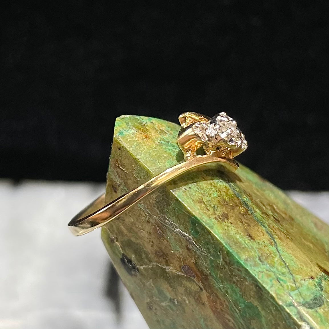 Three stone diamond ring cast in yellow gold.