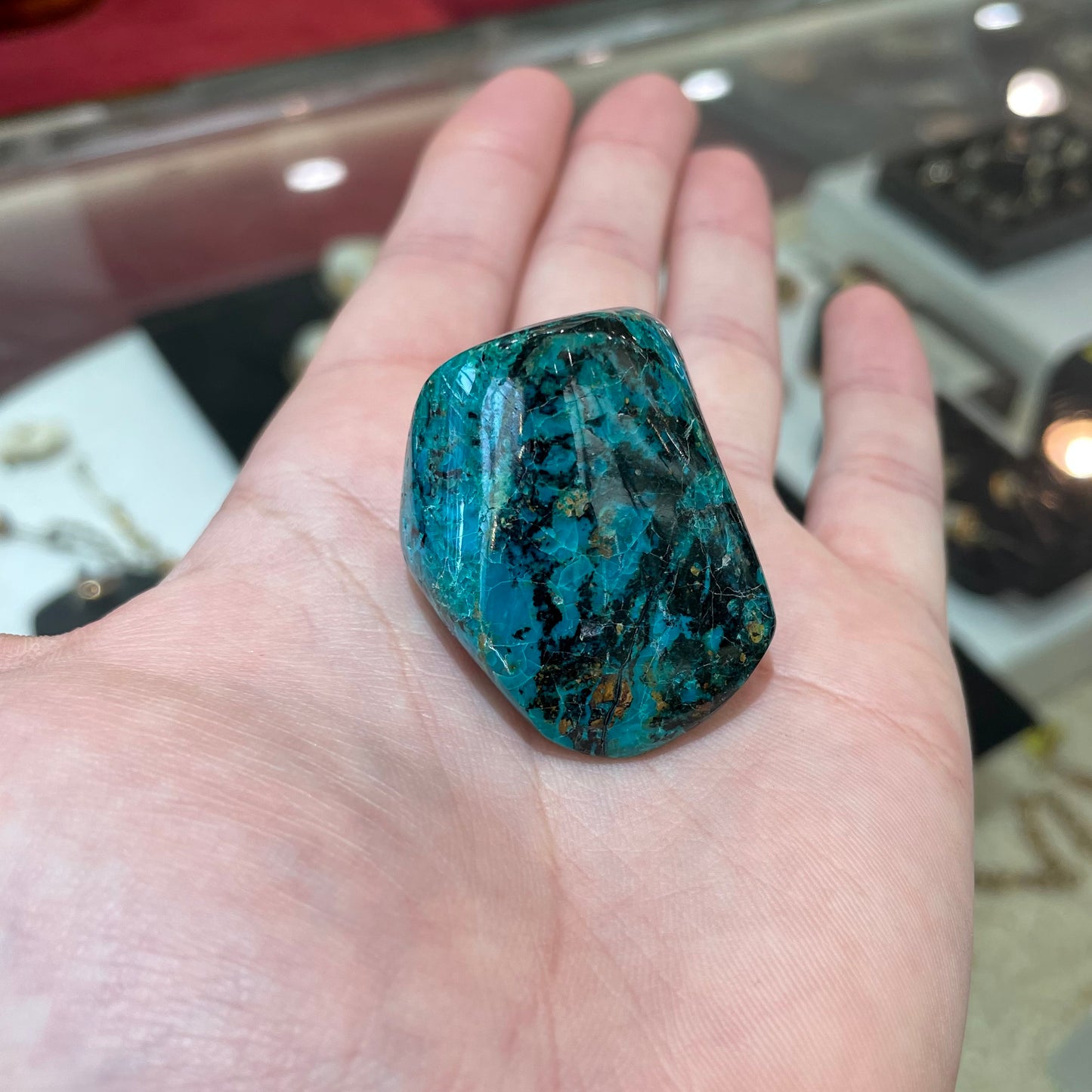 A polished freeform shaped chrysocolla specimen.