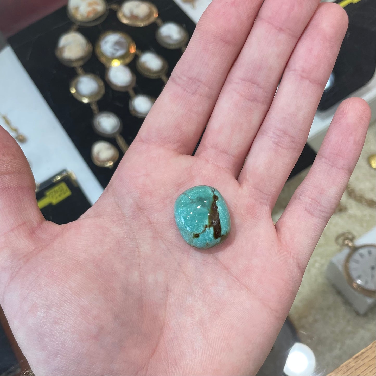 A loose, cushion shaped cabochon cut turquoise stone from Royston District, Nevada.