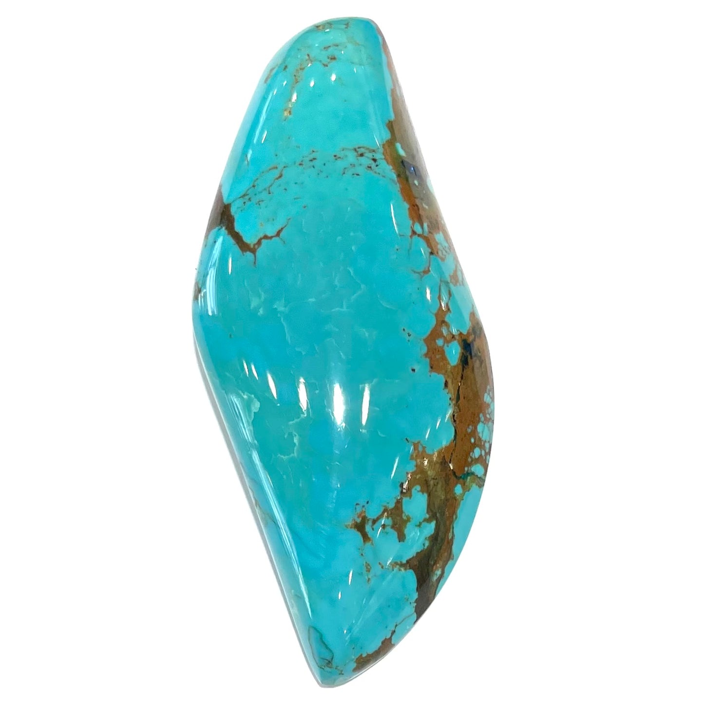 A freeform cabochon cut Bisbee turquoise stone. The stone has been dyed to improve color.