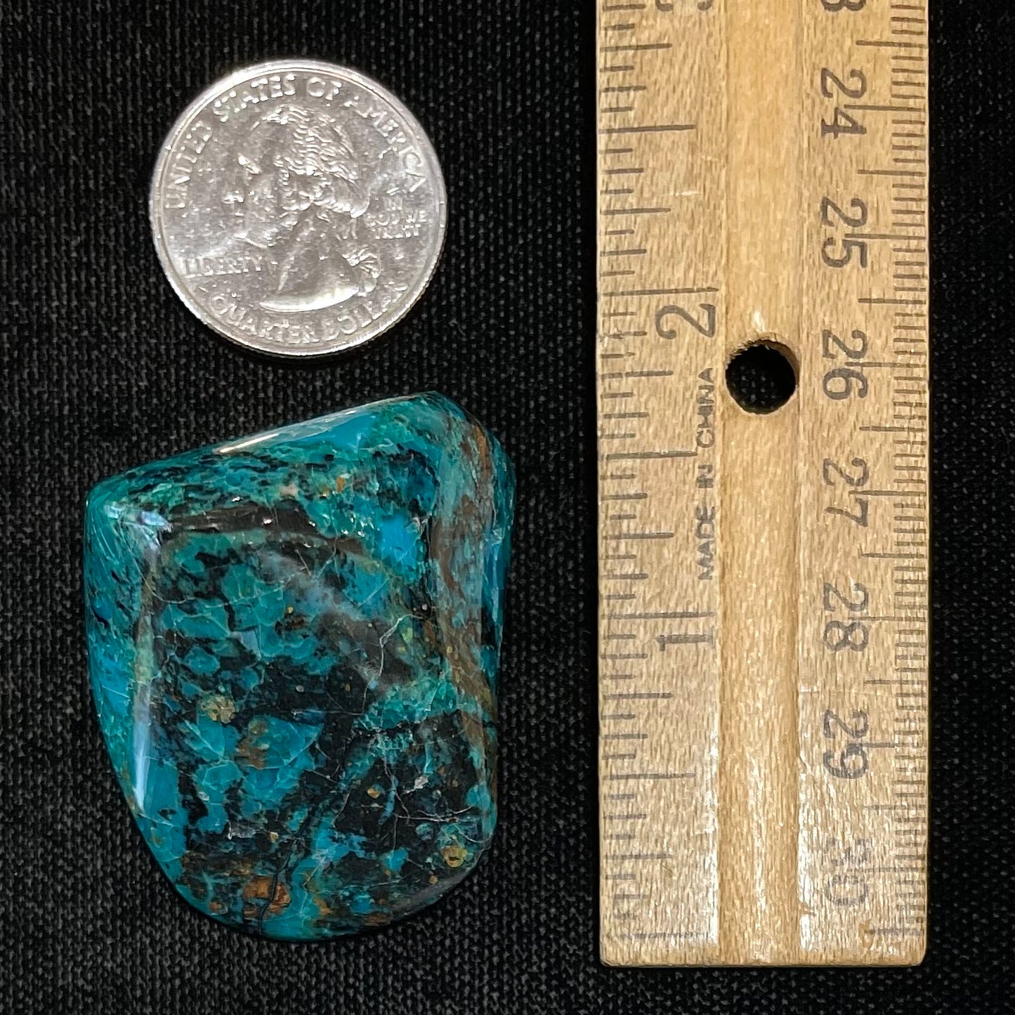 A polished freeform shaped chrysocolla specimen.
