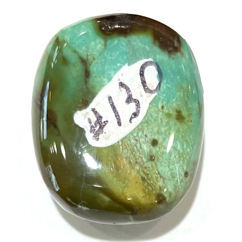 A loose, cushion shaped cabochon cut turquoise stone from Royston District, Nevada.