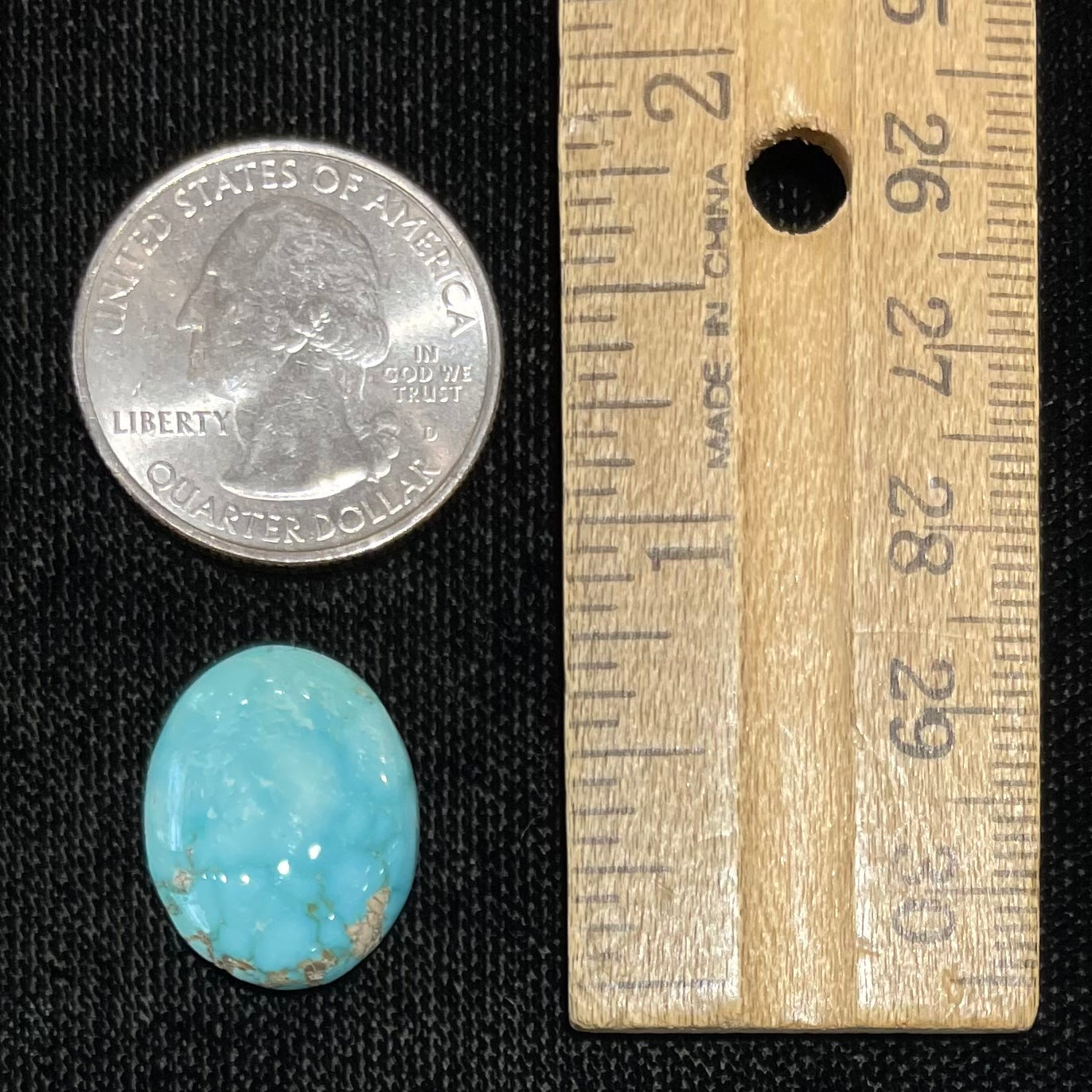 A loose, oval cabochon cut blue turquoise stone from Sonora, Mexico.