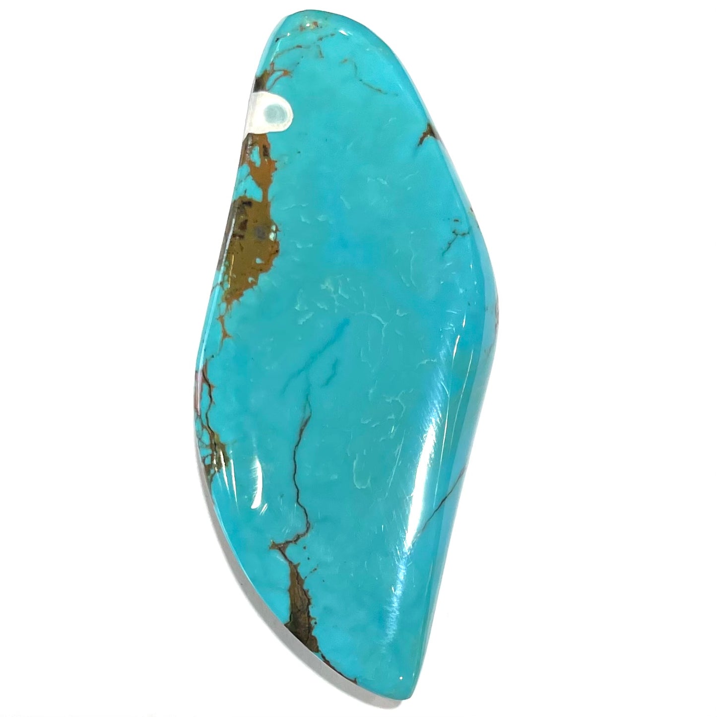 A freeform cabochon cut Bisbee turquoise stone. The stone has been dyed to improve color.