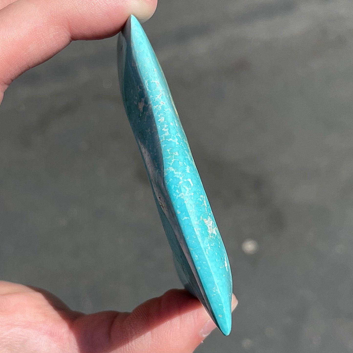 A large, polished baby blue Sleeping Beauty turquoise specimen.