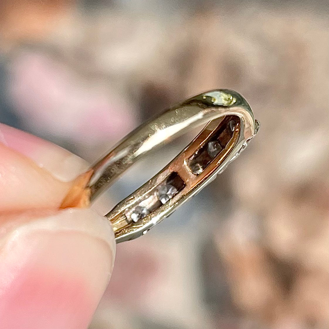 A vintage ladies' five-stone round cut diamond yellow gold wedding band