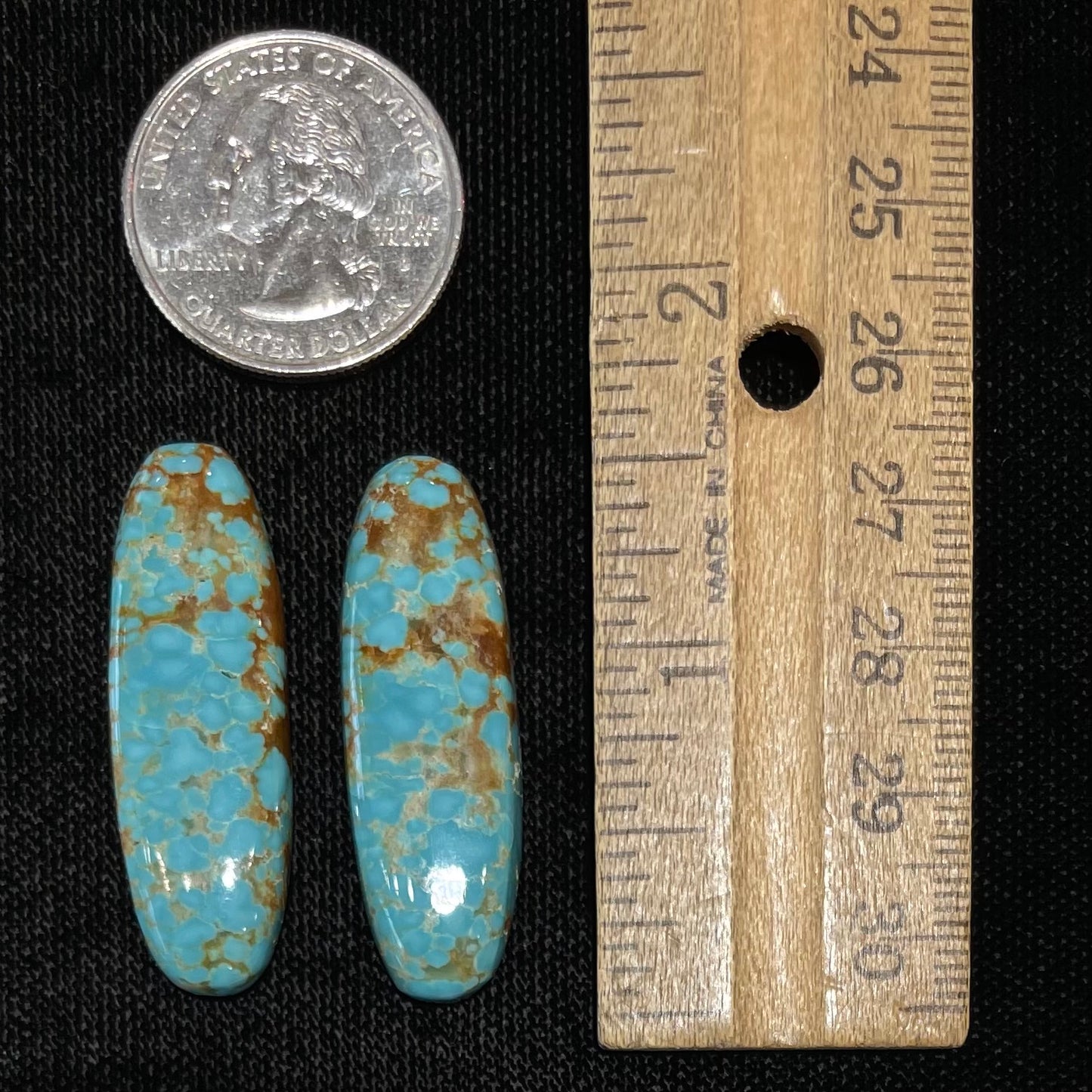 A pair of loose oval cabochon cut turquoise stones from Number 8 Mine, Nevada.