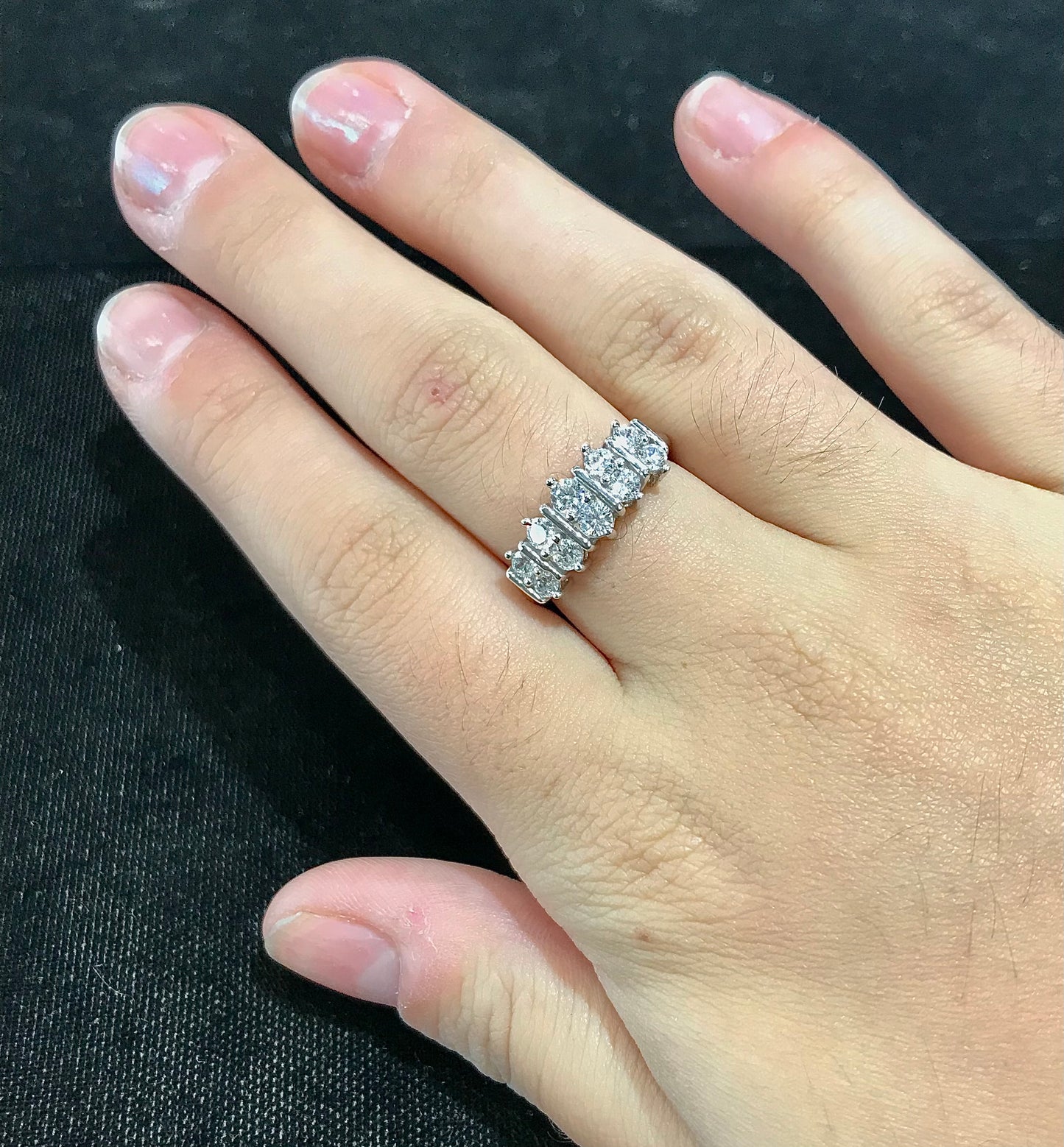 White Cubic Zirconia ring band set in sterling silver.