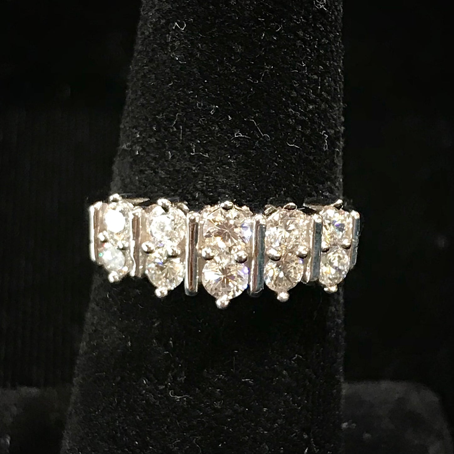 White Cubic Zirconia ring band set in sterling silver.