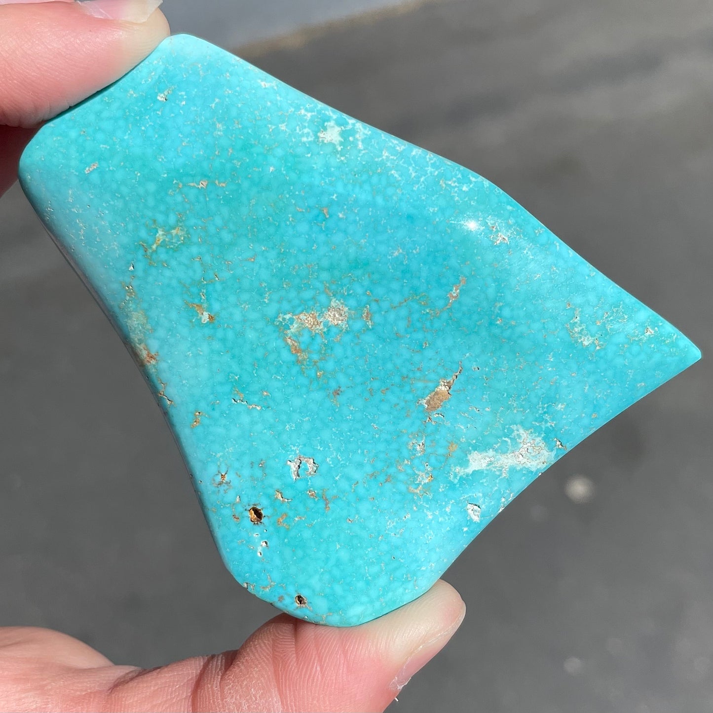 A large, polished baby blue Sleeping Beauty turquoise specimen.