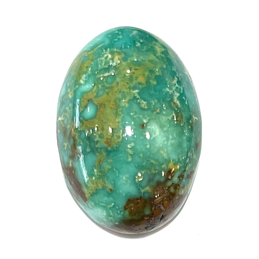 A loose, oval cabochon cut, green turquoise stone from Royston Mining District, Nevada.