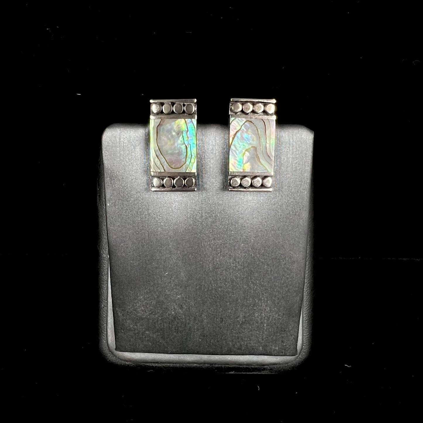 A pair of mother of pearl shell earrings set in sterling silver.