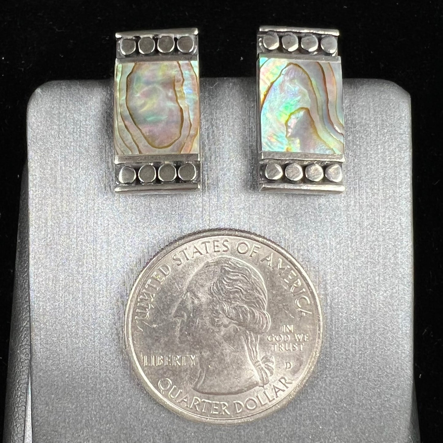 A pair of mother of pearl shell earrings set in sterling silver.