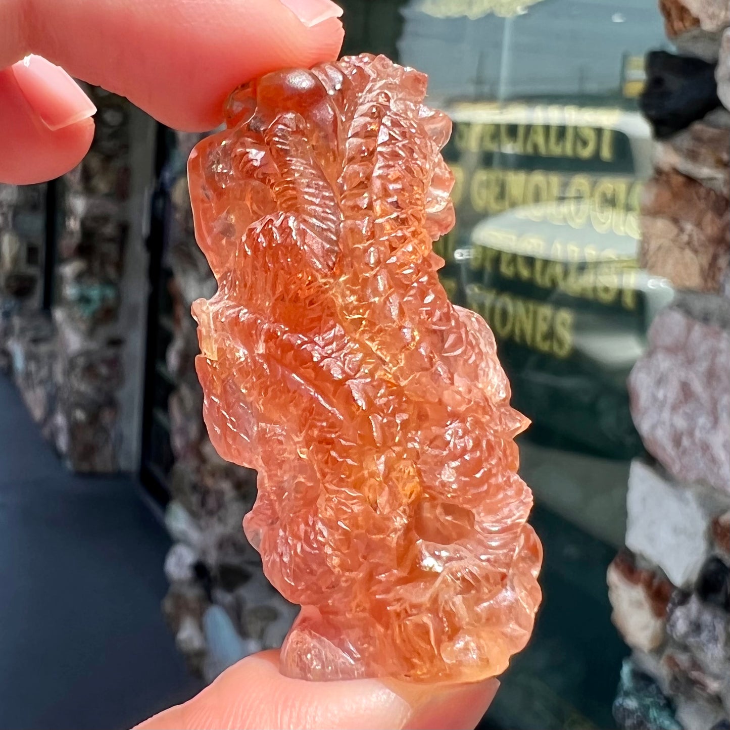 A dragon carved by Ronald Stevens from imperial topaz crystal.