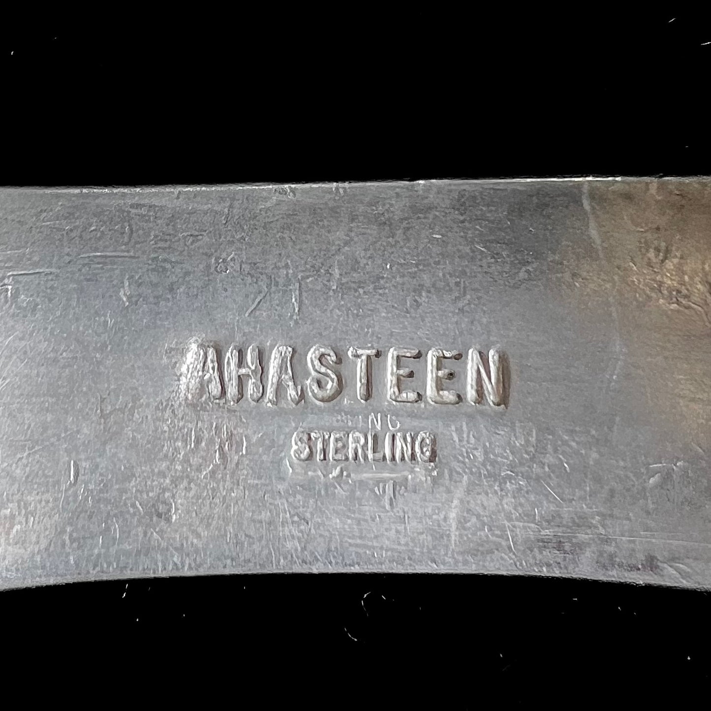 A vintage sterling silver stone inlay cuff bracelet, signed "AHASTEEN" by the Navajo artsit.