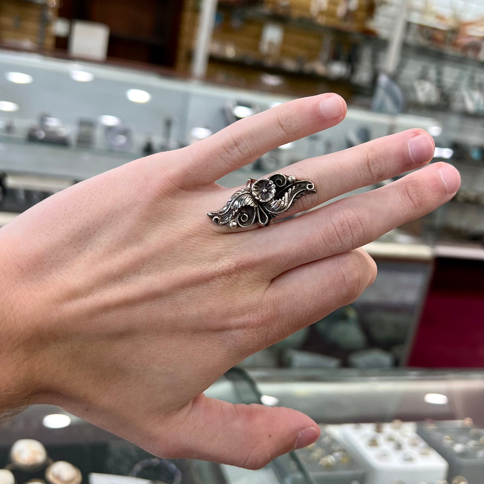 A sterling silver Navajo flower ring.