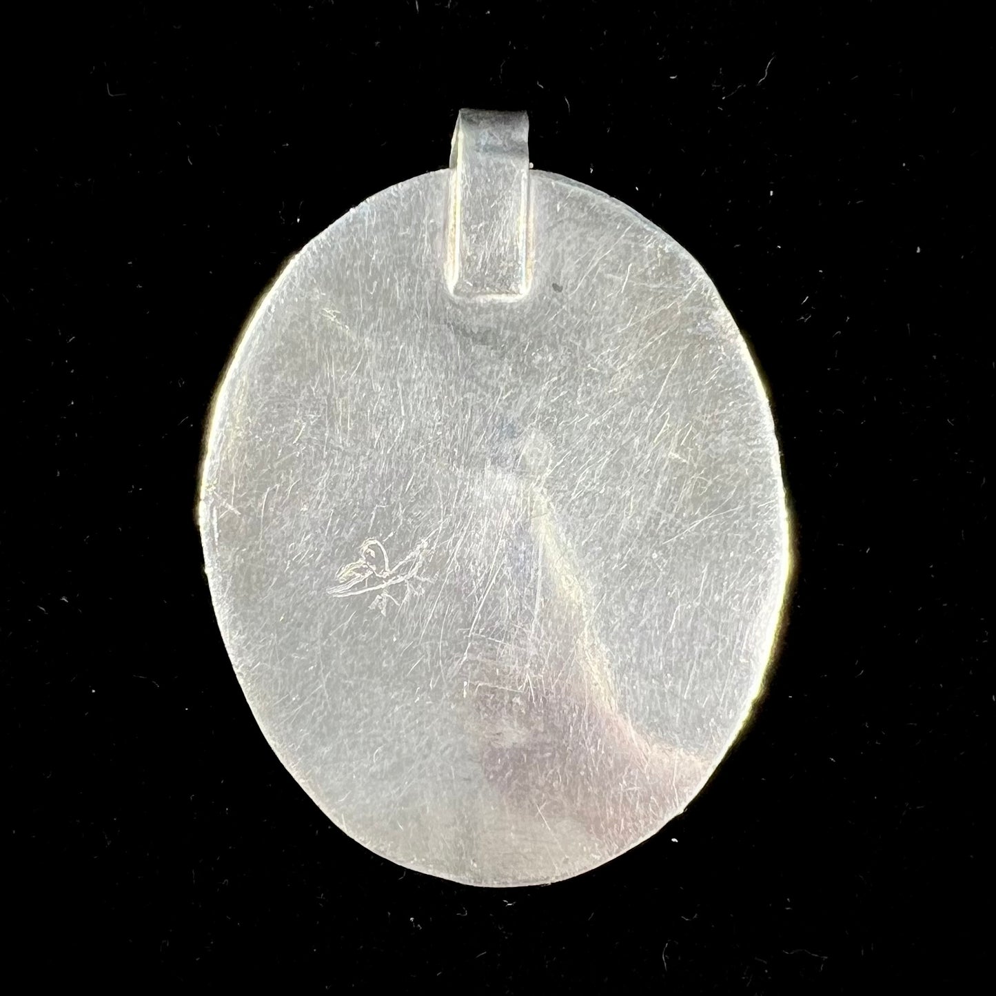 A sterling silver Native American pendant set with a piece of blue turquoise from Courtland-Gleeson Mining District, Arizona.