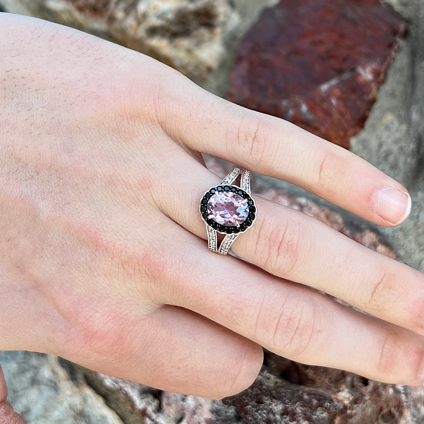 Sterling silver ladies' ring made with Rose de France amethyst set in a black spinel halo with white topaz accents.