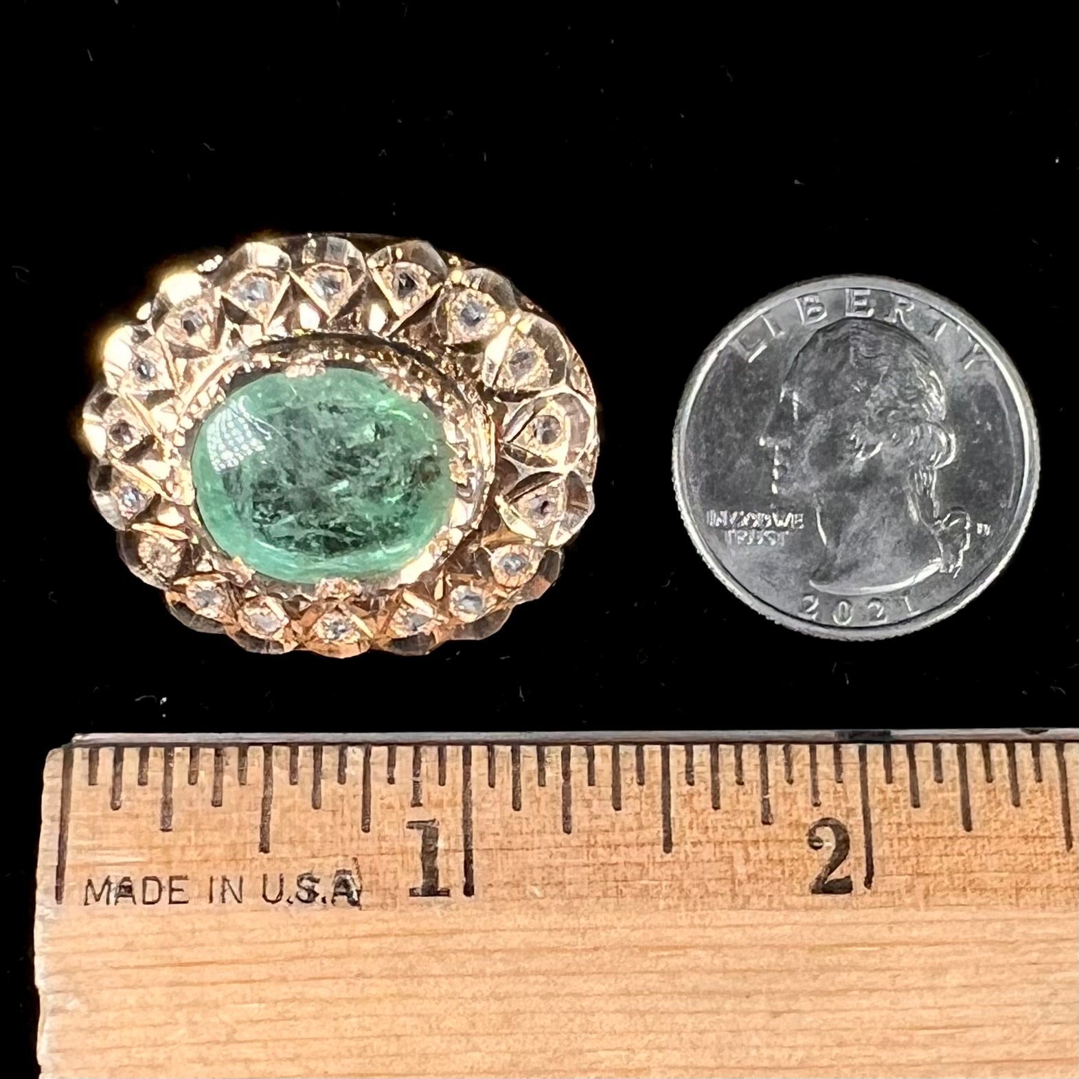 An antique 1800's Victorian emerald and diamond crystal brooch made in 18kt yellow gold.