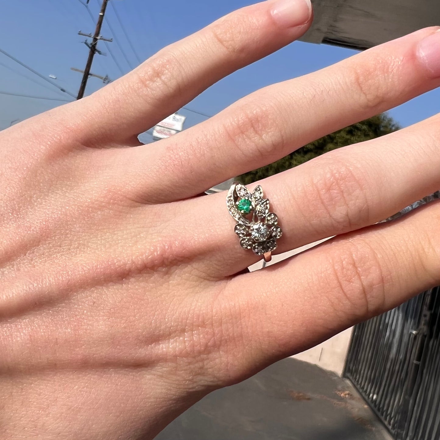 Vintage gold round cut emerald and diamond ring.