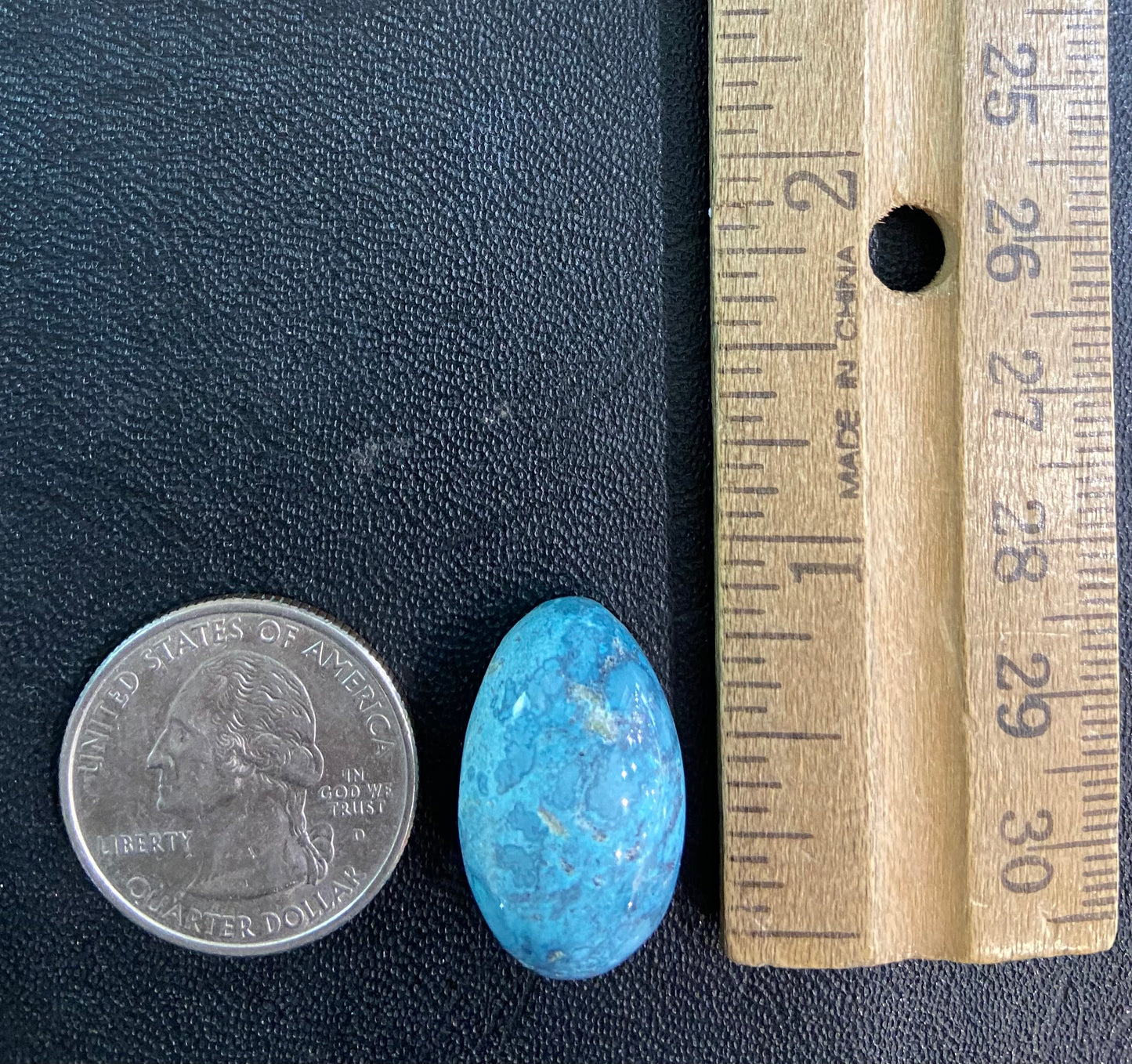 A loose, oval cabochon cut turquoise stone from Baja California.