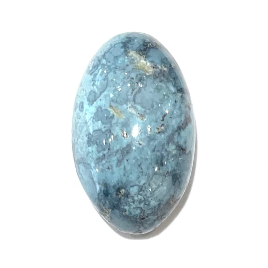 A loose, oval cabochon cut turquoise stone from Baja California.