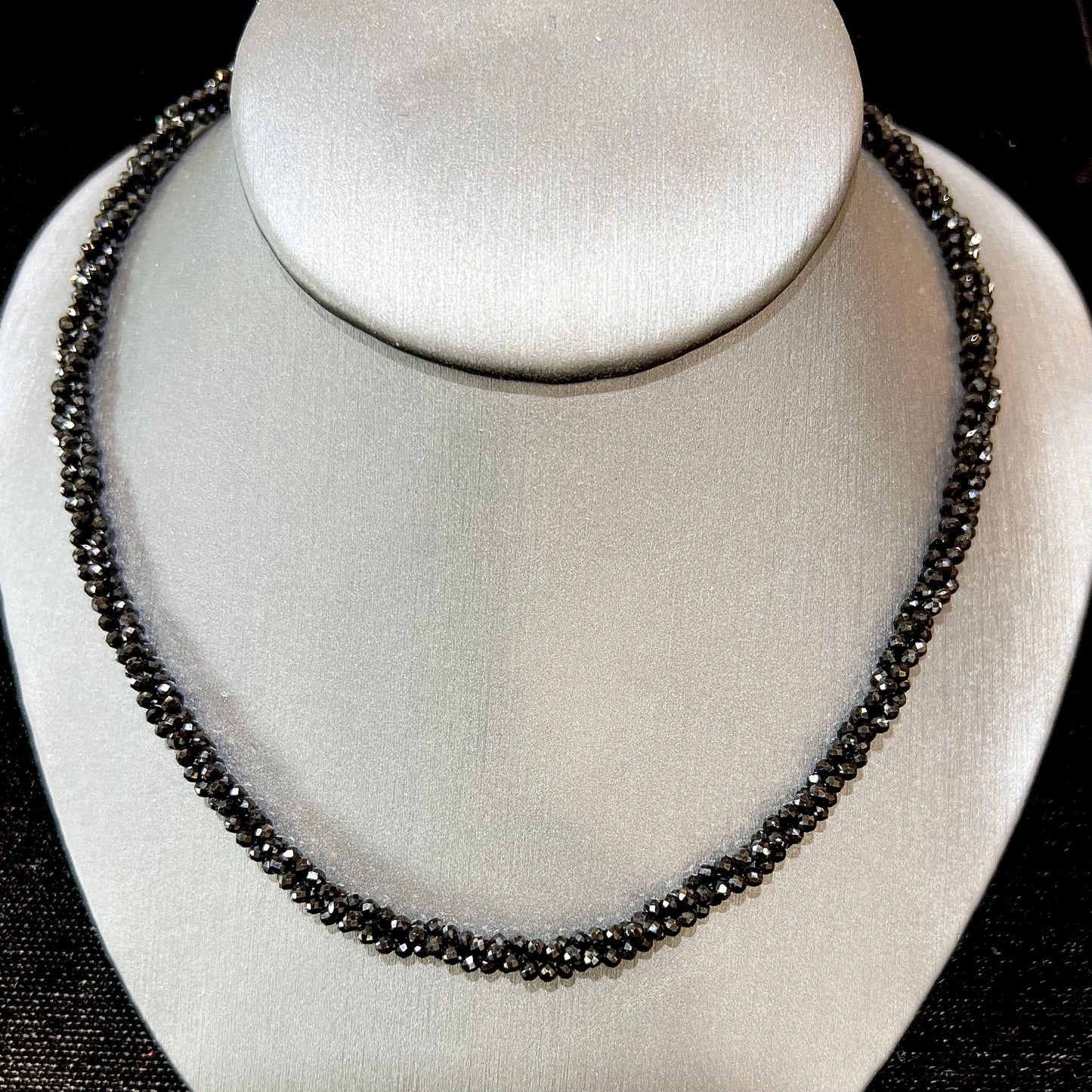 A beaded necklace made of black spinel.