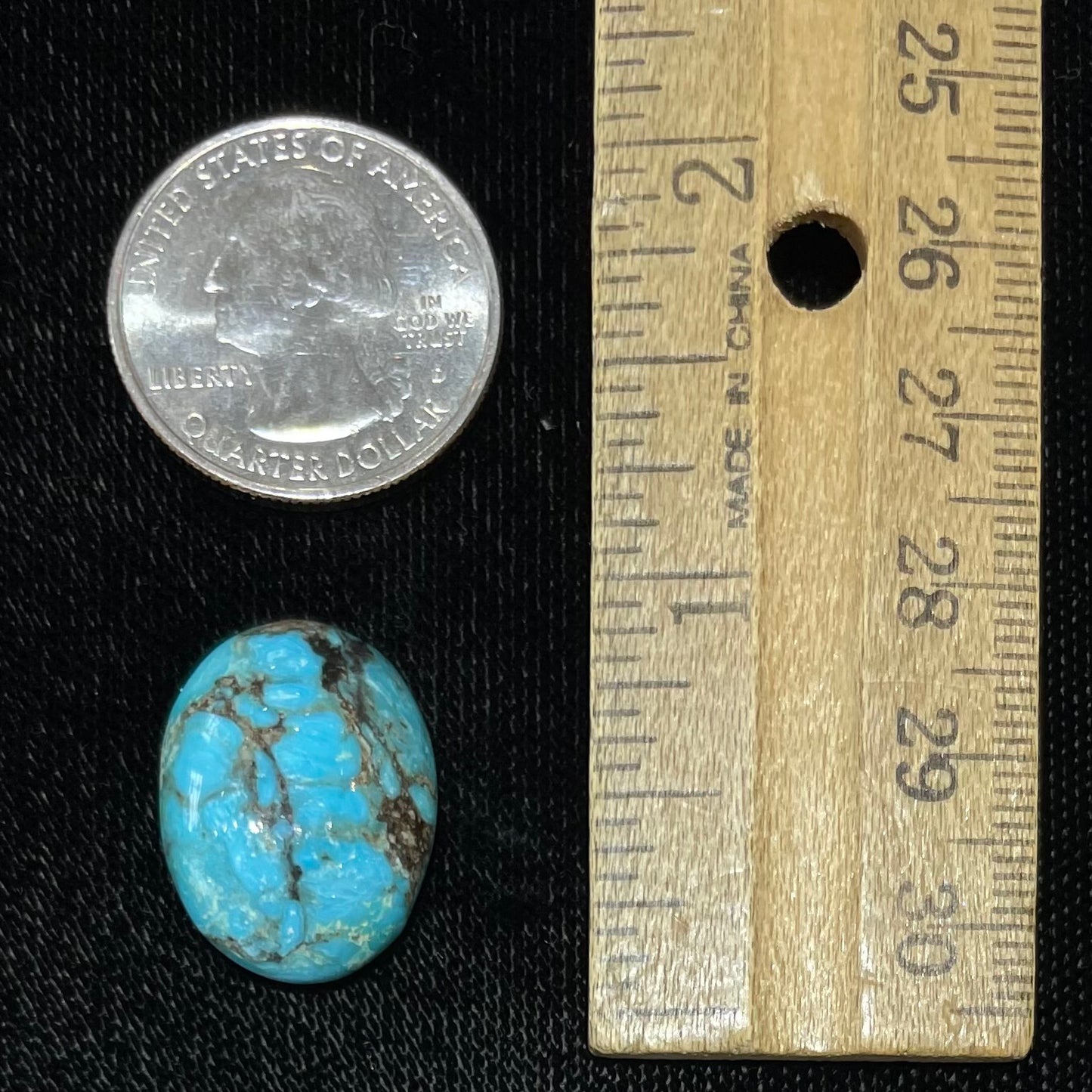 A loose, oval cabochon cut turquoise stone from the Valley Blue Mine in Lander County, Nevada.