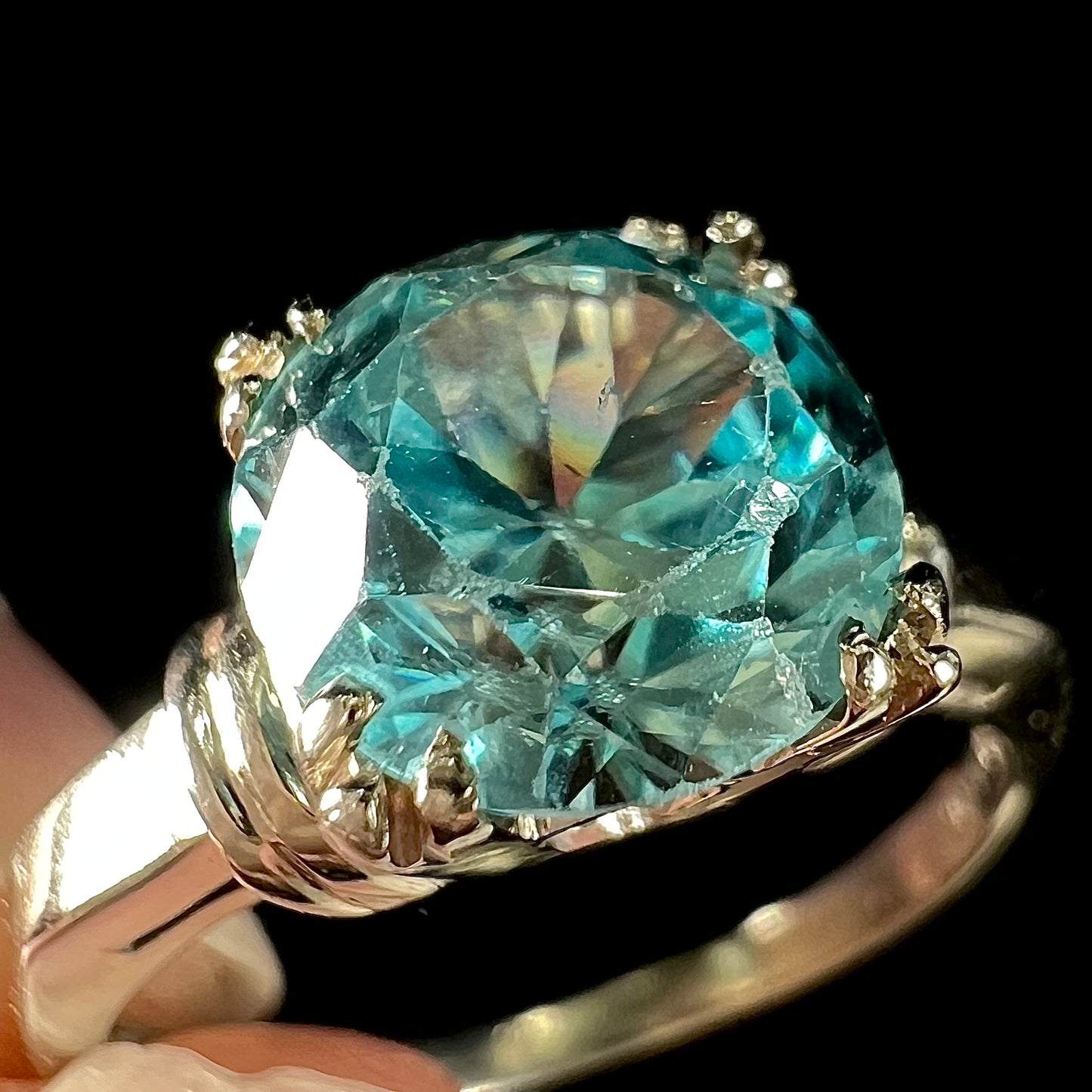 A ladies' vintage white gold solitaire ring set with a round brilliant cut blue zircon stone.