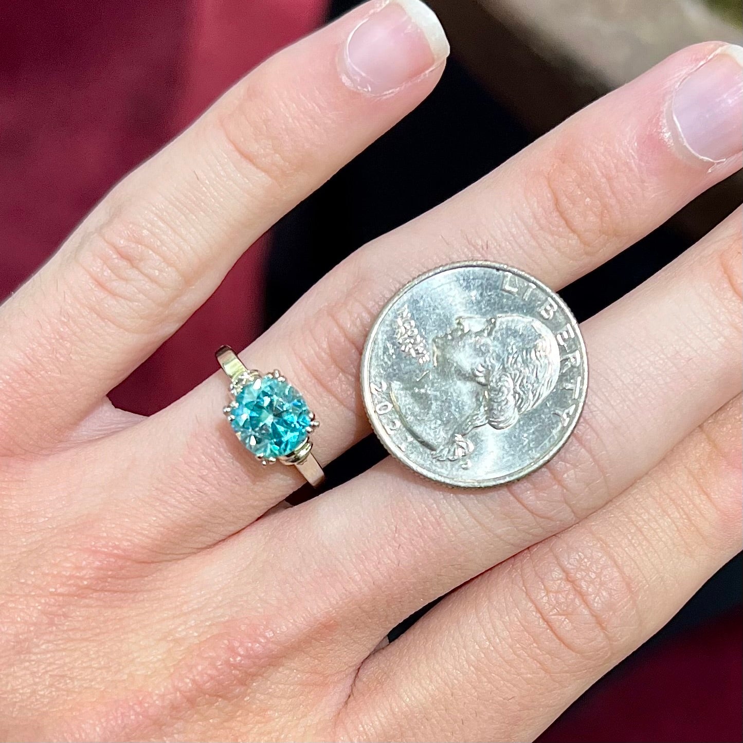 A ladies' vintage white gold solitaire ring set with a round brilliant cut blue zircon stone.