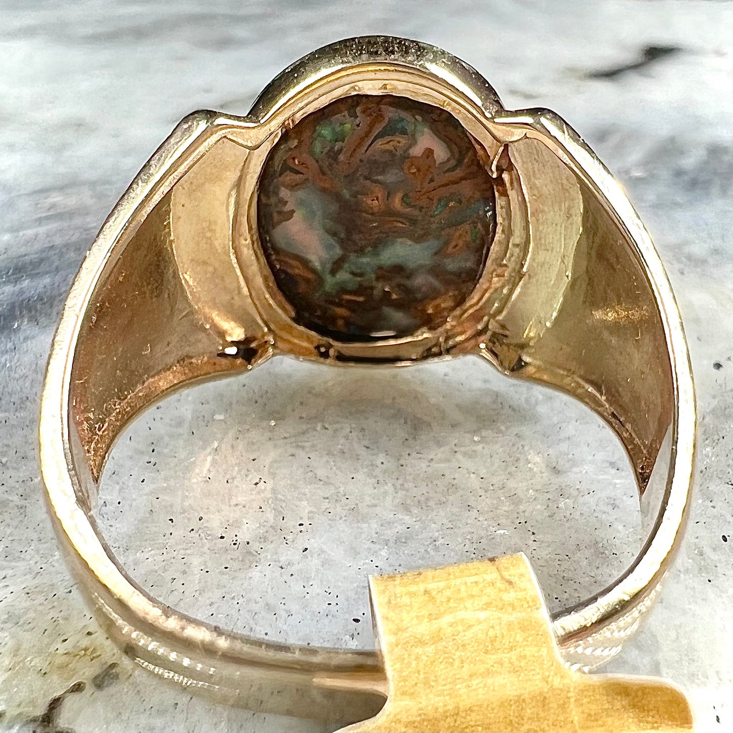 A Koroit boulder opal men's ring in brushed yellow gold.