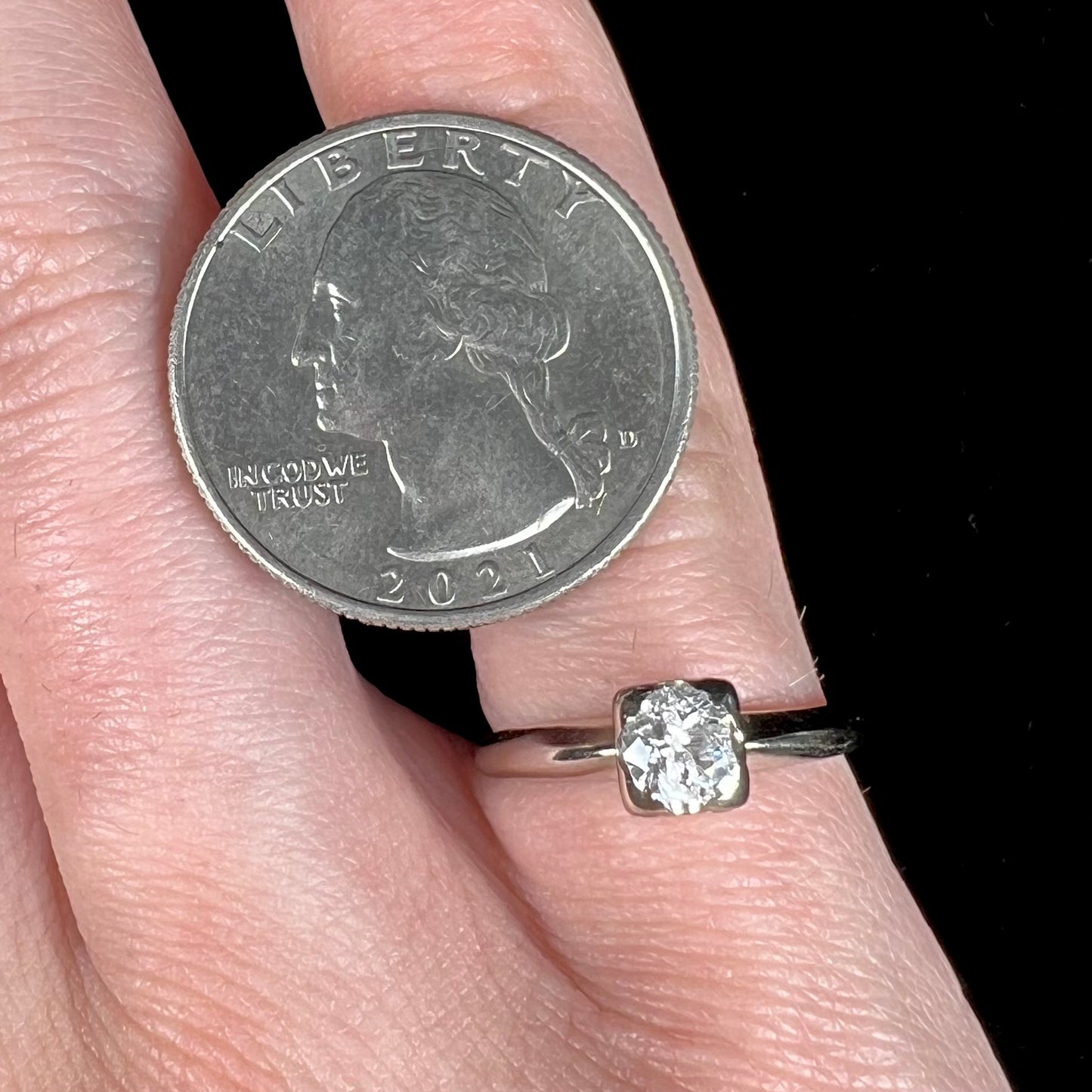 A ladies' vintage 14kt white gold 1940's diamond solitaire ring. The diamond is chipped in two places.