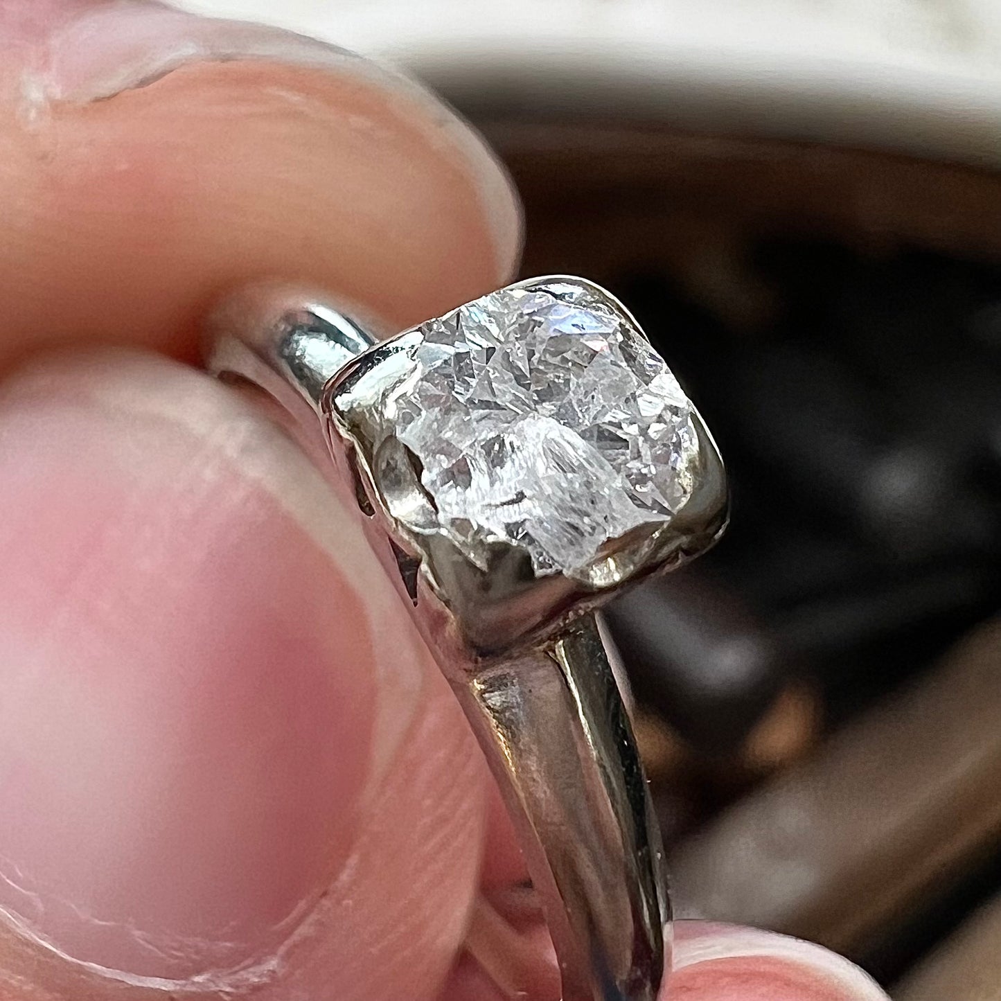A ladies' vintage 14kt white gold 1940's diamond solitaire ring. The diamond is chipped in two places.